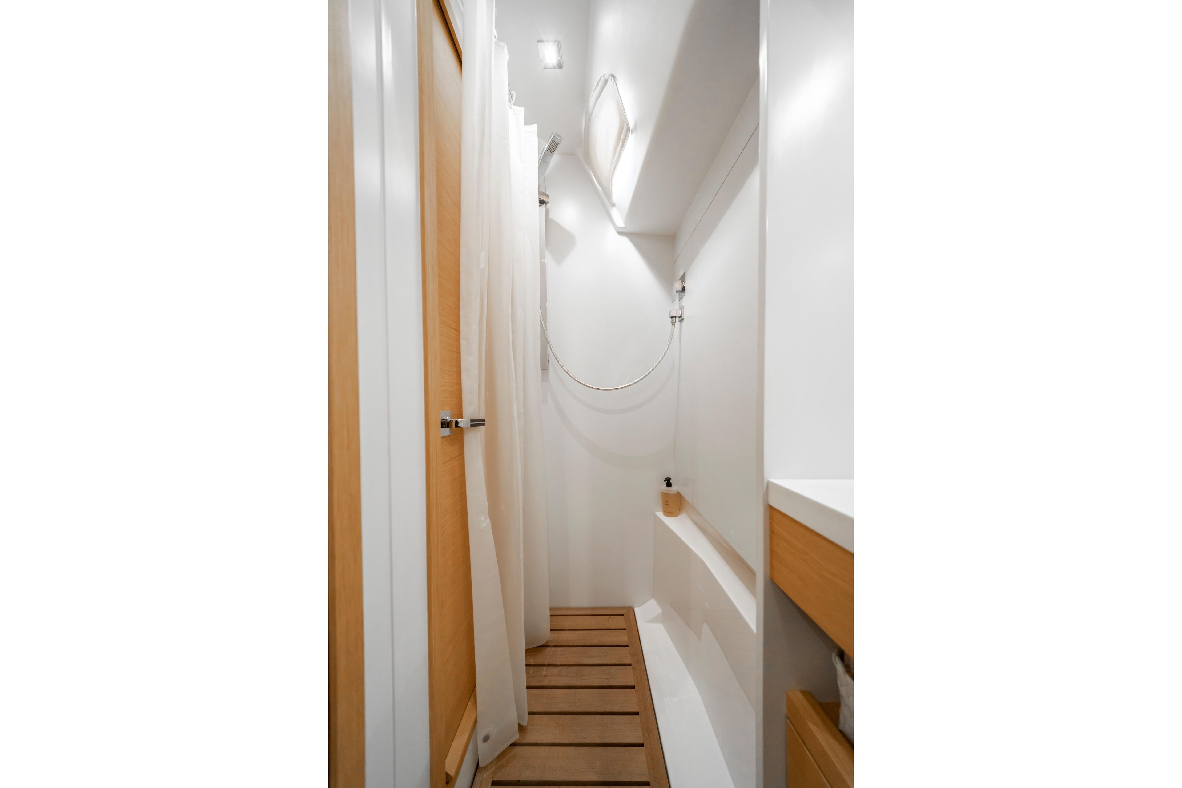 Modern bathroom interior on 2016 Grand Soleil 58 yacht, featuring wooden accents and sleek design.