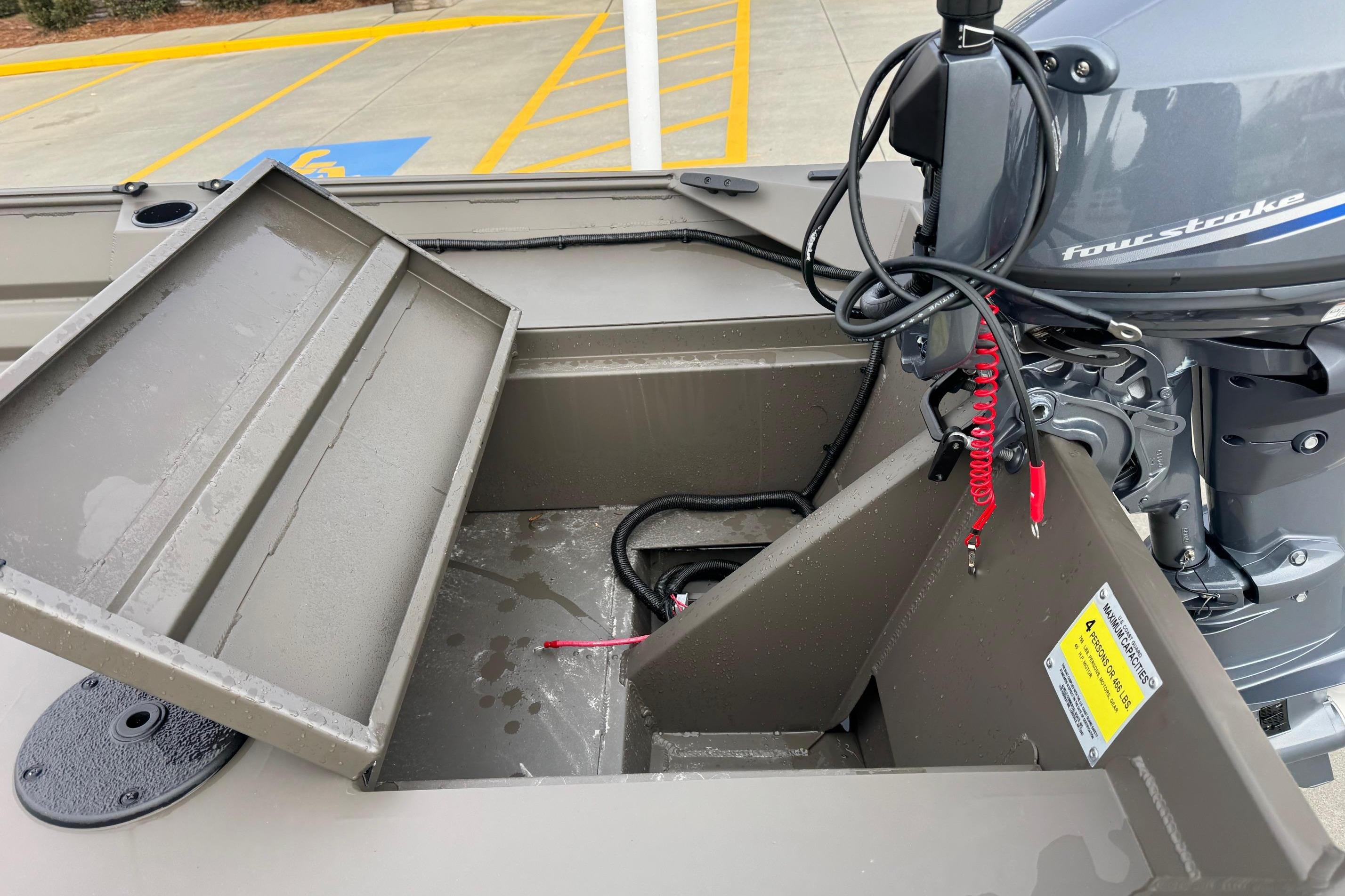 2026 Alweld 1548VV Marsh boat interior with four-stroke engine and open storage compartment.