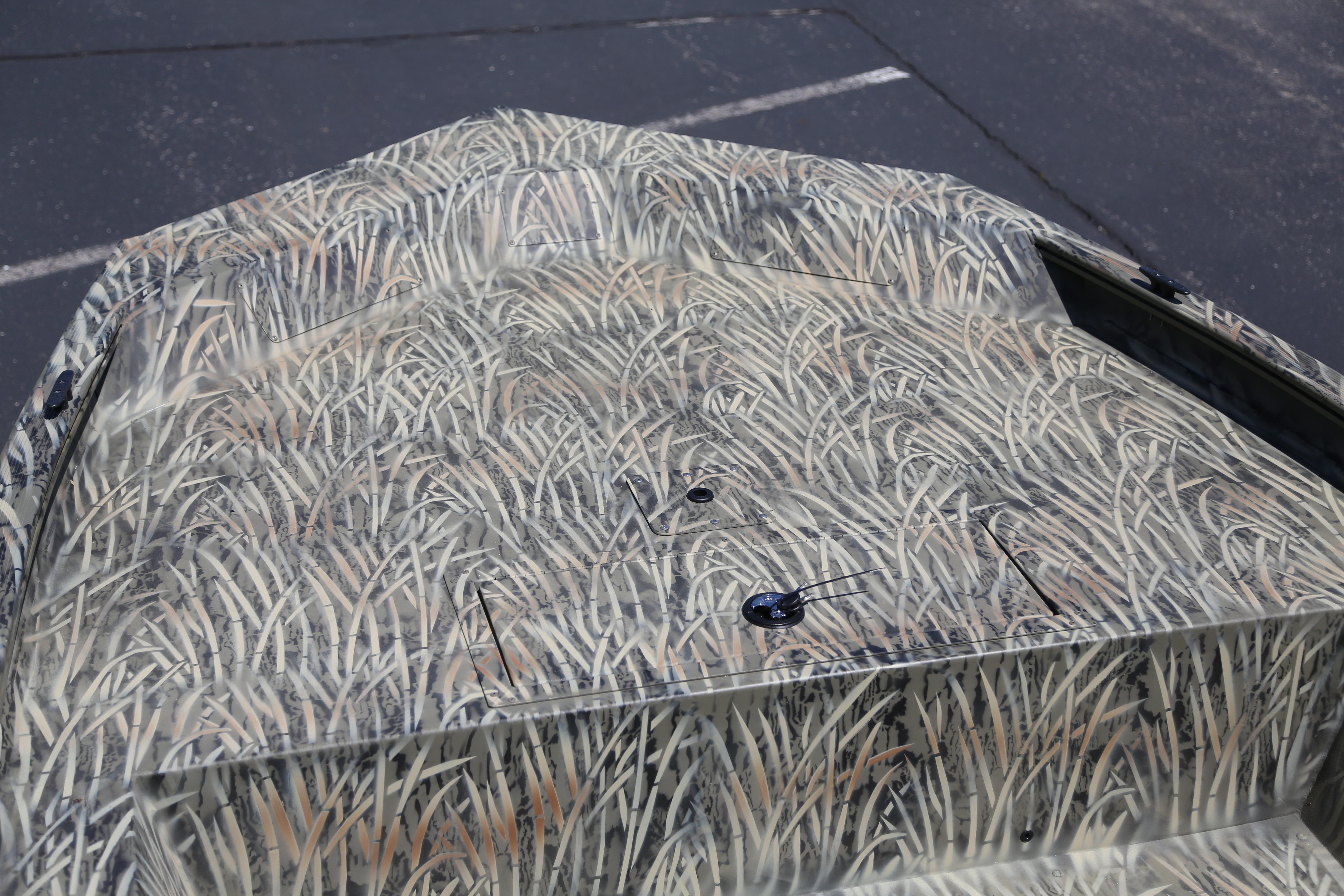 2026 Tracker Grizzly 1754 Utility boat with camouflage pattern on deck.
