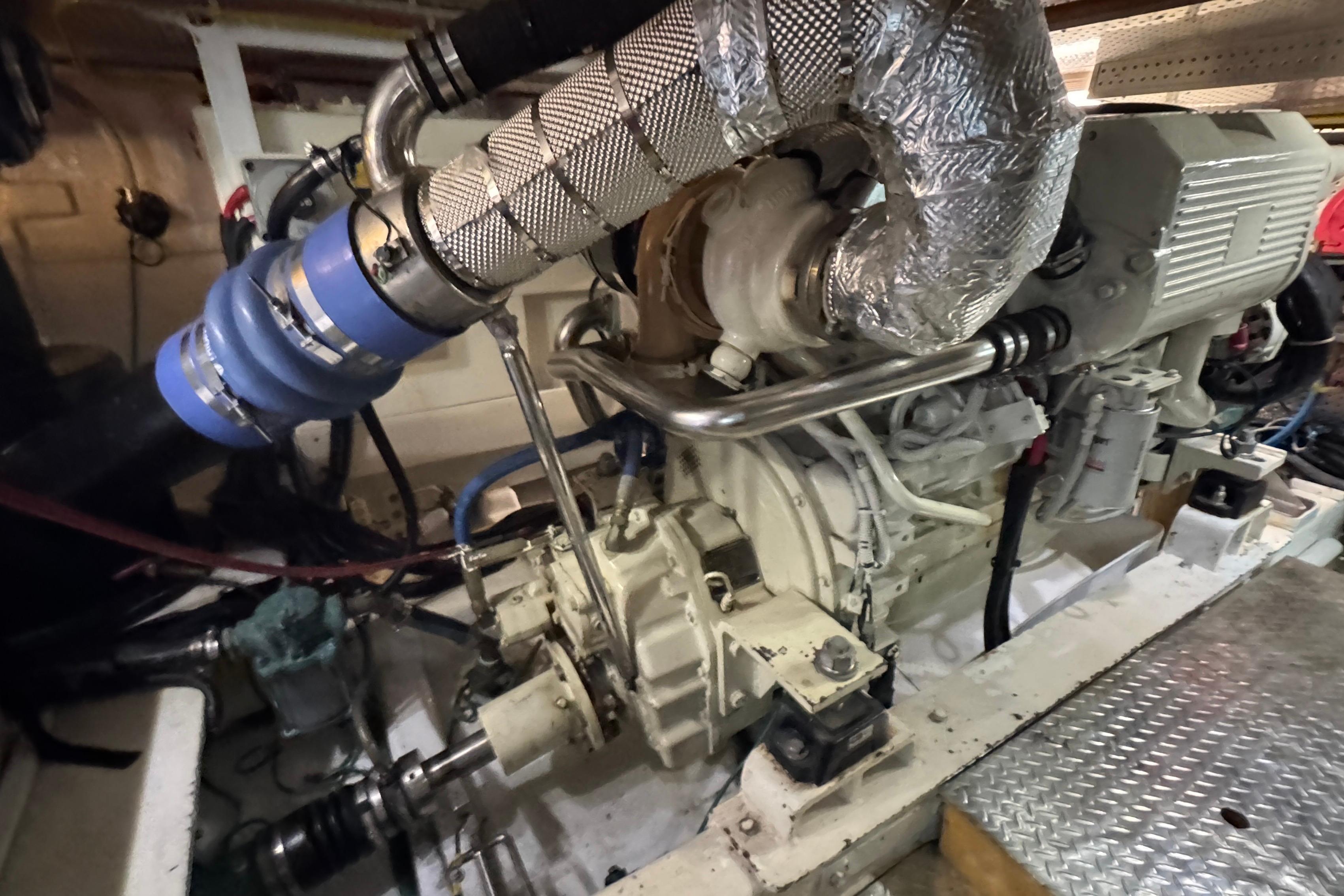 Engine room of a 2007 Jefferson Pilothouse 52 SE yacht, showcasing mechanical components.