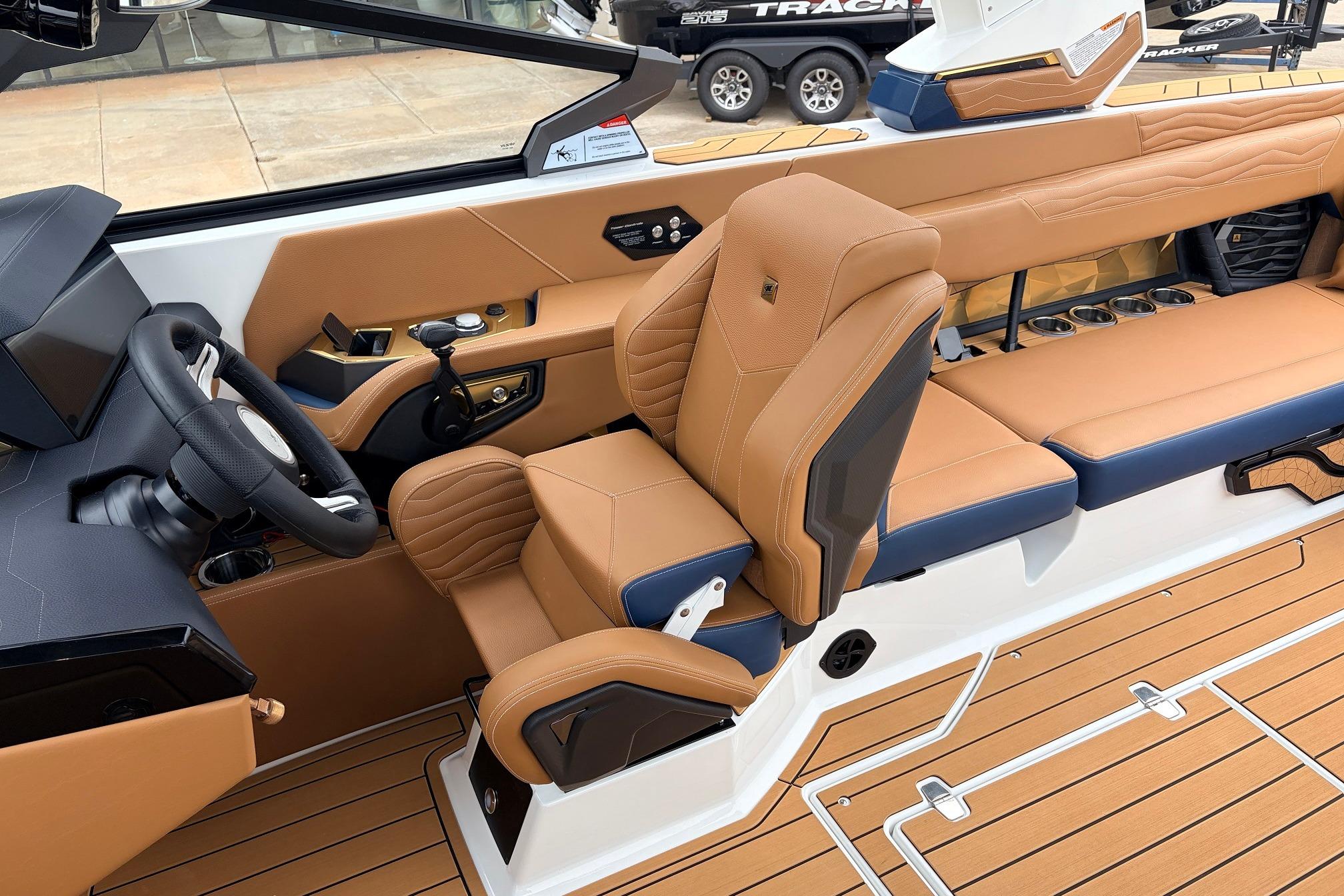 2026 Nautique Super Air Nautique G25 interior with tan leather seats and modern dashboard.