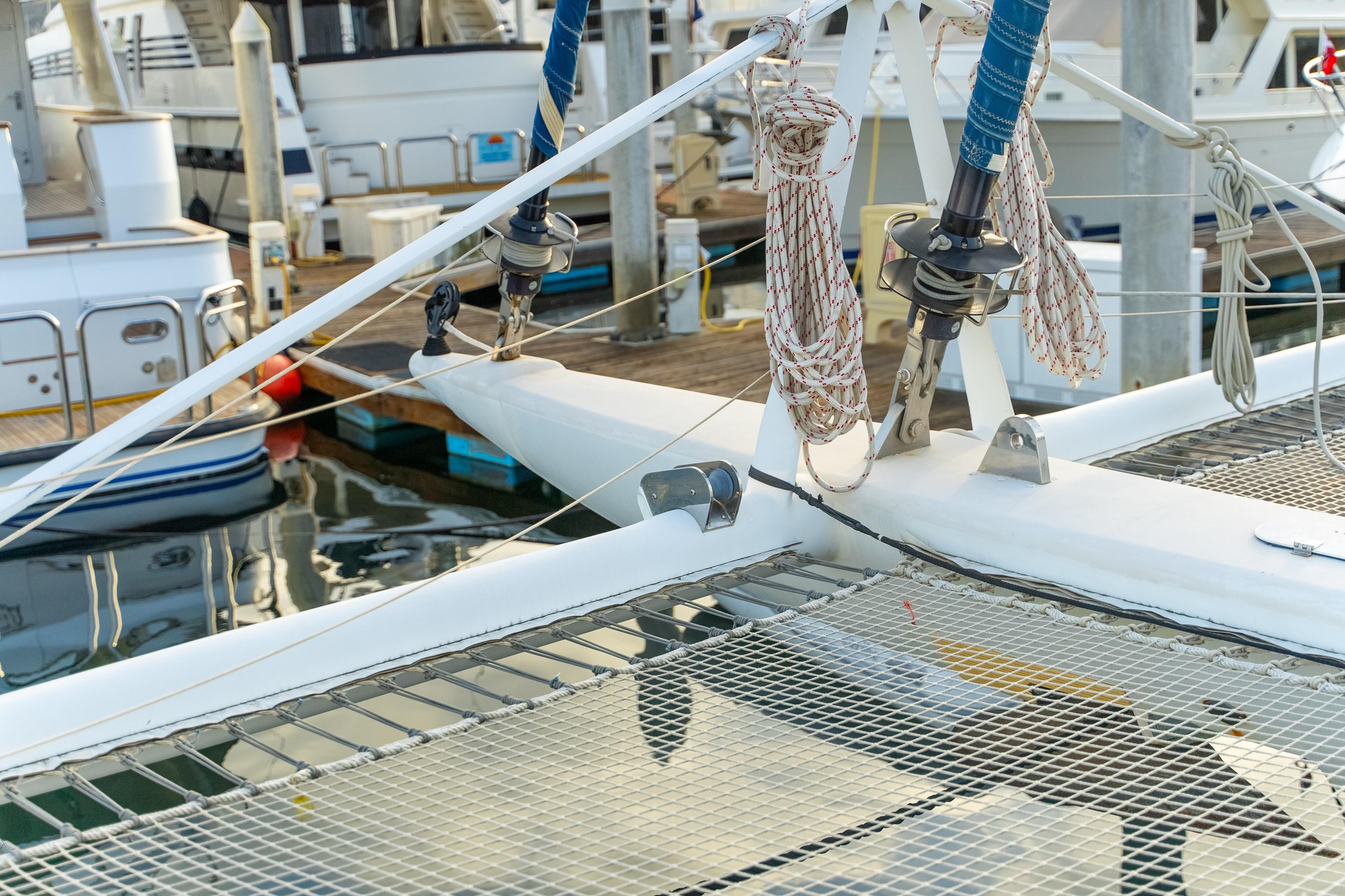 Catana 65 catamaran, 2009 model, docked with visible rigging and netting.