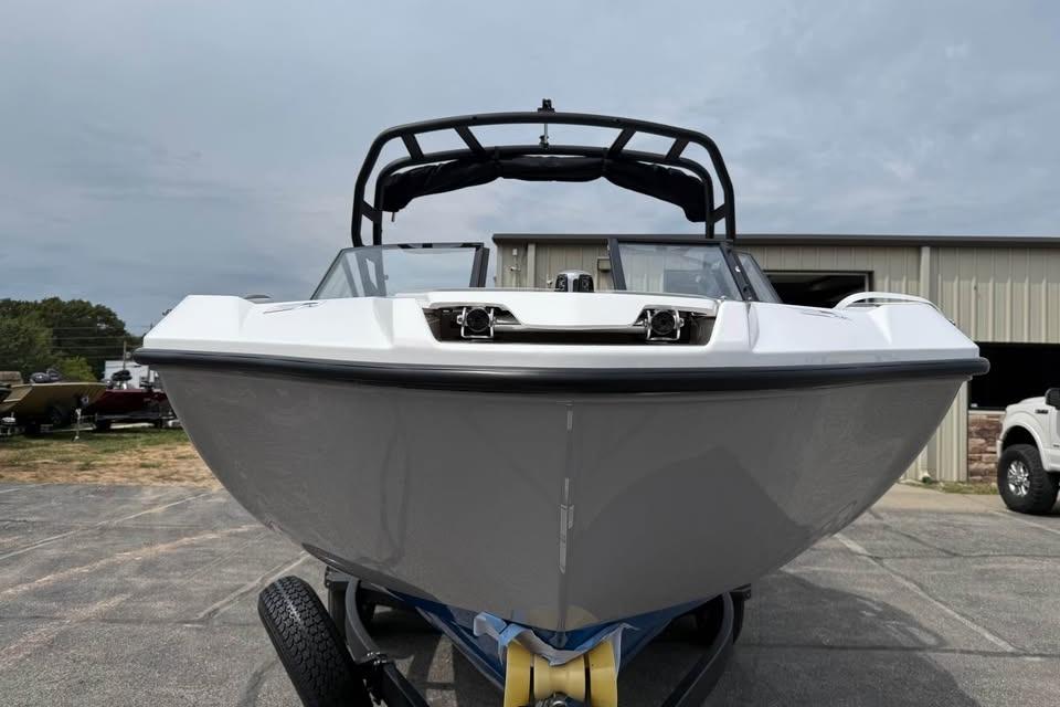 2026 Yamaha Boats AR220, sleek design, parked outdoors on a trailer.