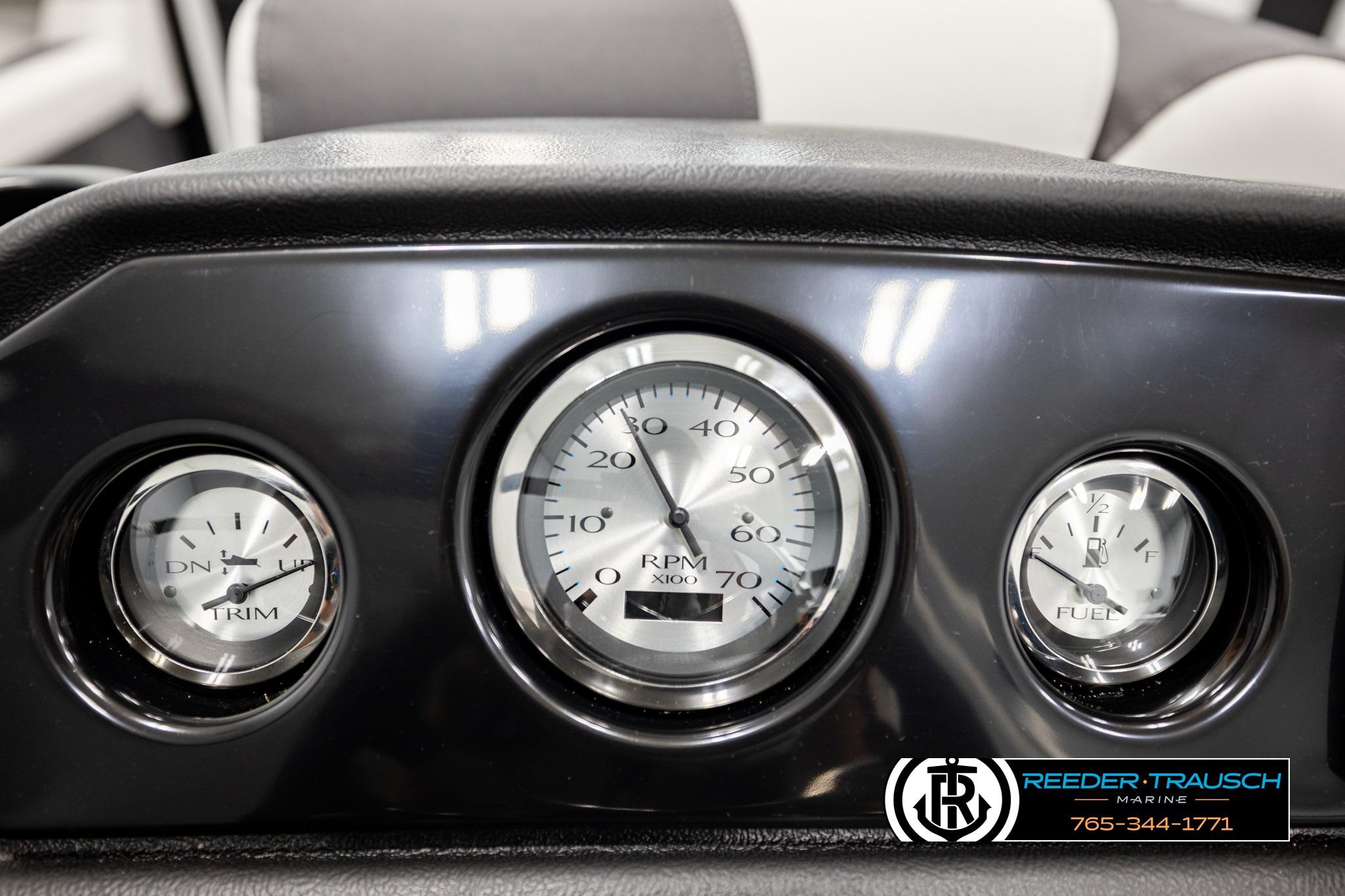 Dashboard of 2026 Bennington SLSF boat with trim, RPM, and fuel gauges.