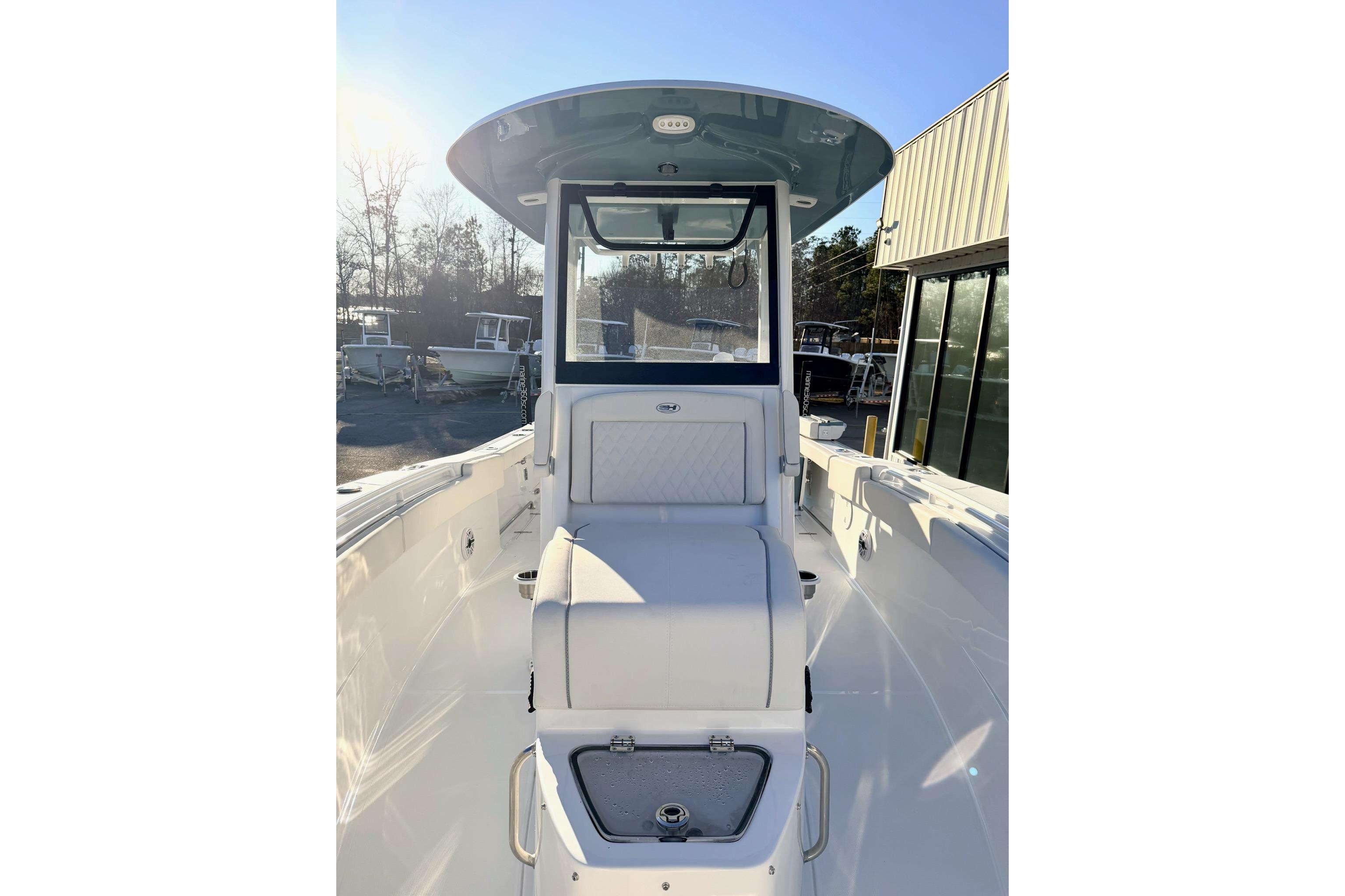 2026 Sea Hunt Ultra 275 Coffin Box boat interior with seating and console.