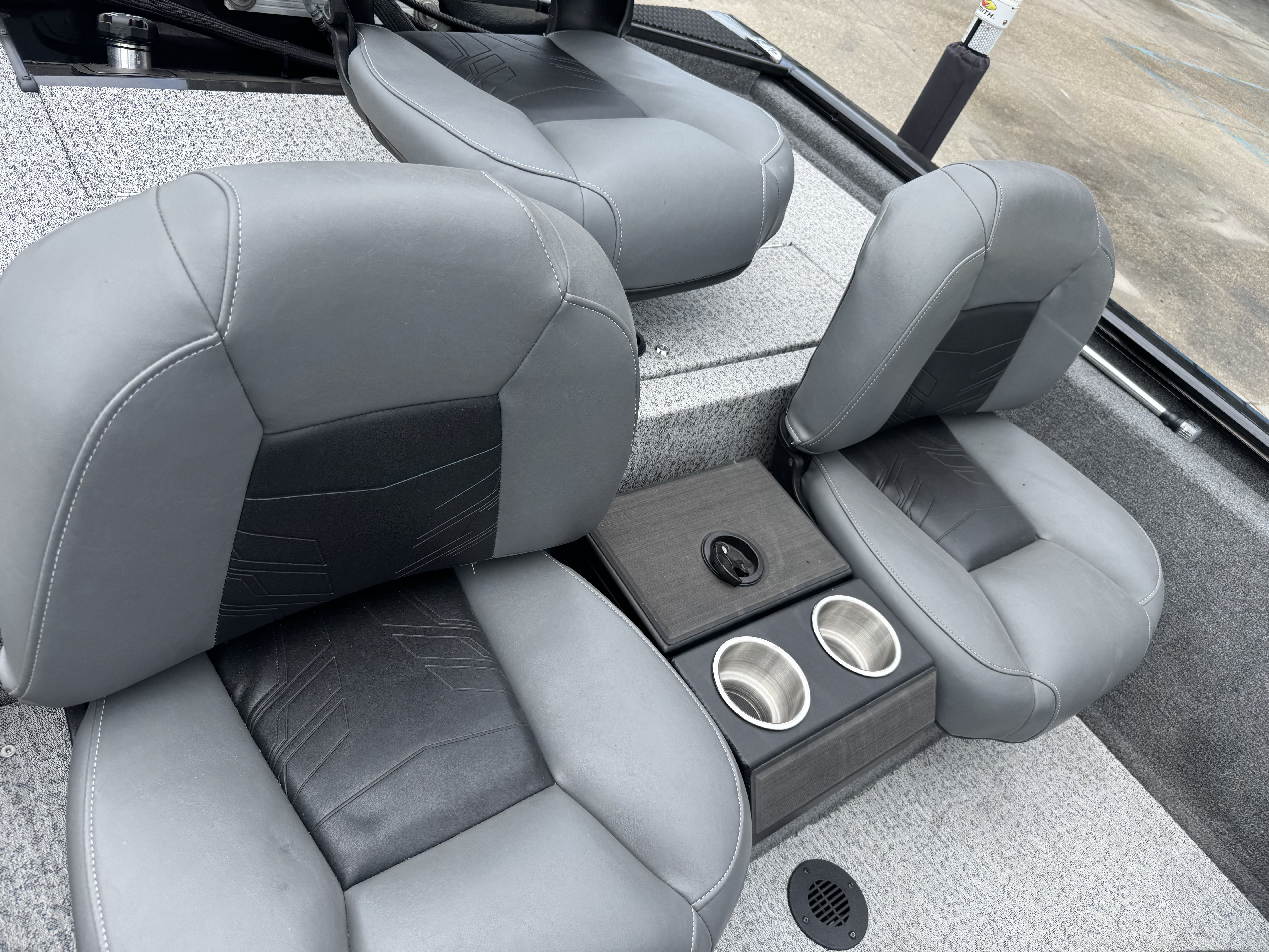2024 Tracker Pro 170 boat interior with gray seats and cup holders.