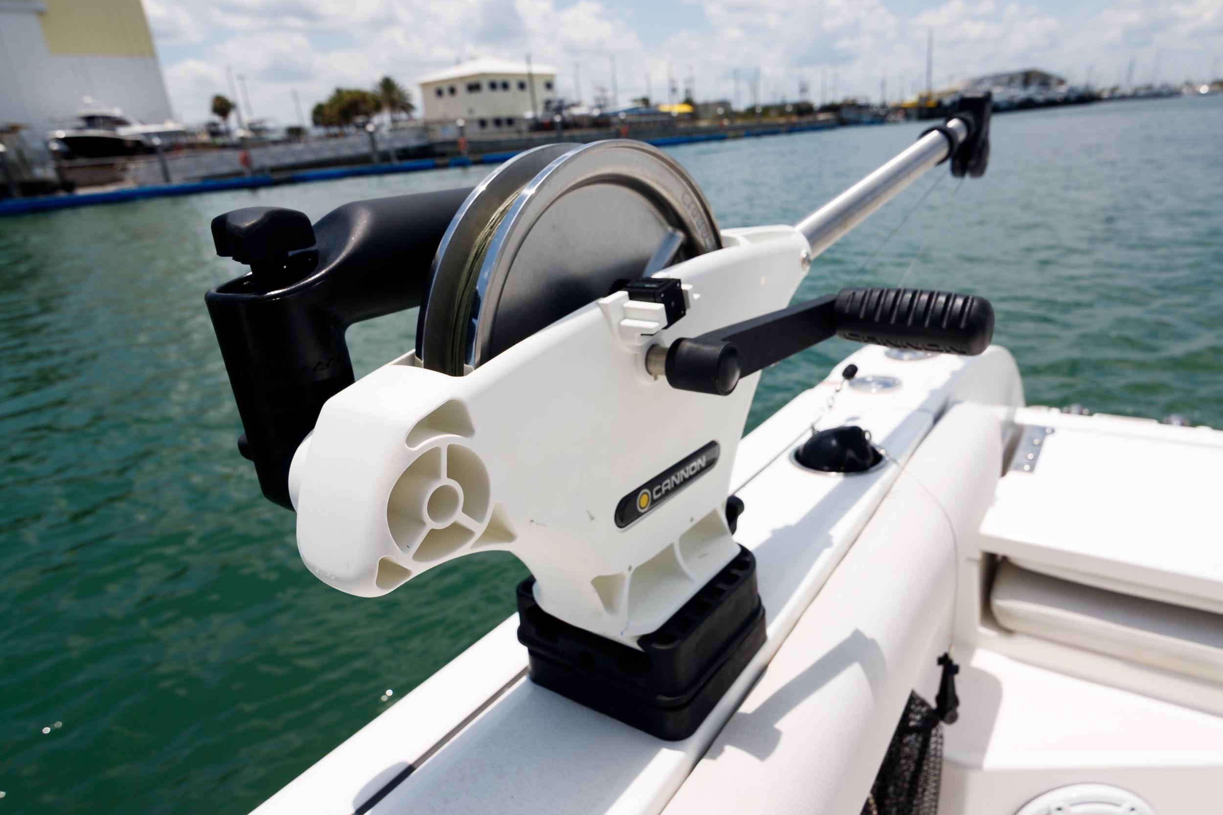 Fishing equipment on a 2021 Sea Fox 328 Commander boat, docked in a marina.