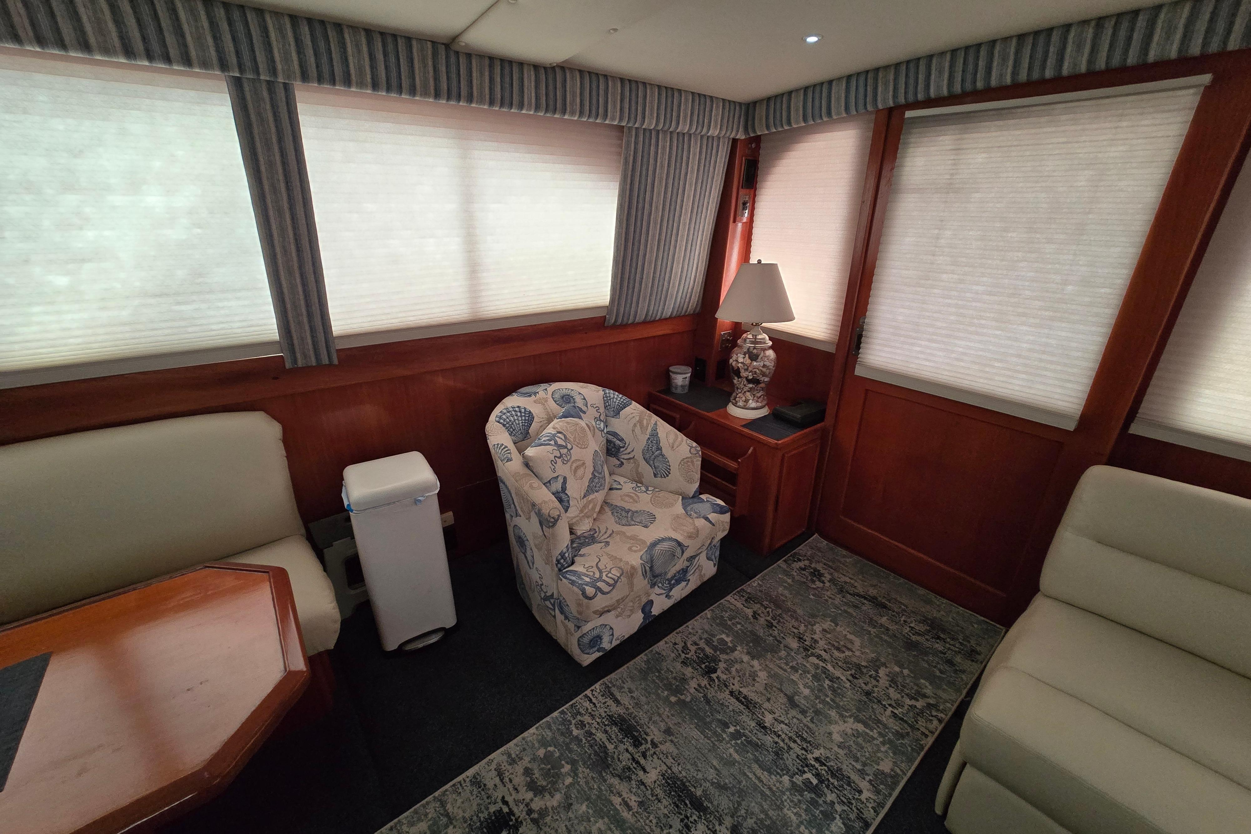 Interior of 1988 Post 46 Convertible yacht with cozy seating and elegant decor.