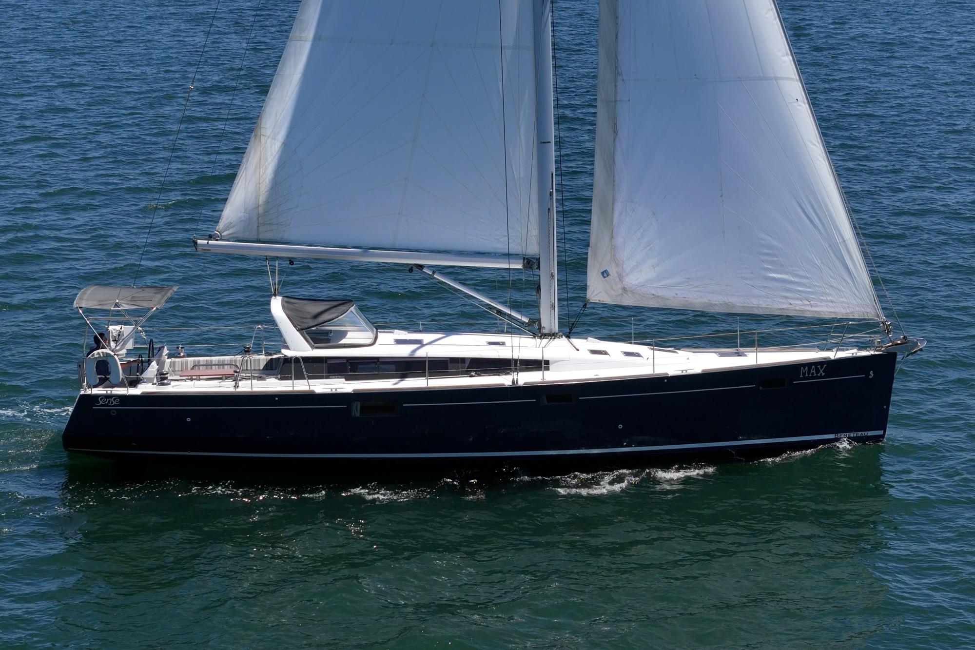 2017 Beneteau Sense 50 sailing yacht on open water, showcasing sleek design and white sails.