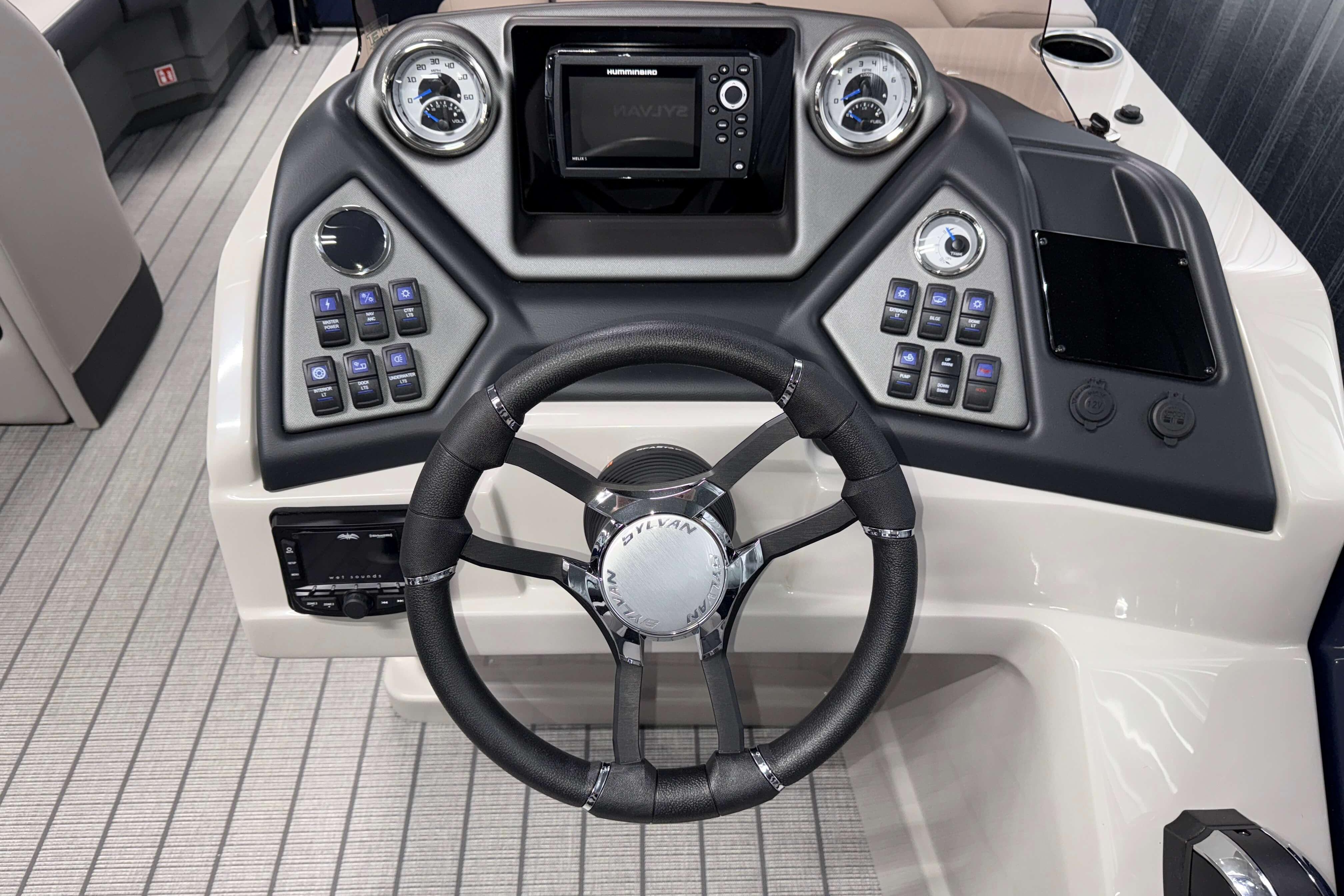 2026 Sylvan L3 SLZ boat dashboard with steering wheel and control panel.