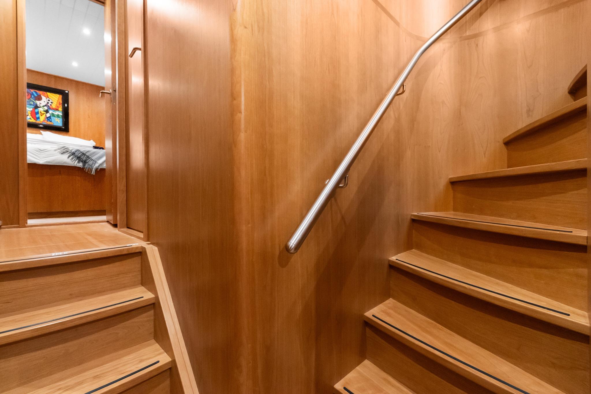 Wooden staircase inside 2022 Alm Trawler Delfino 64 yacht by Jachtbouw De Alm.