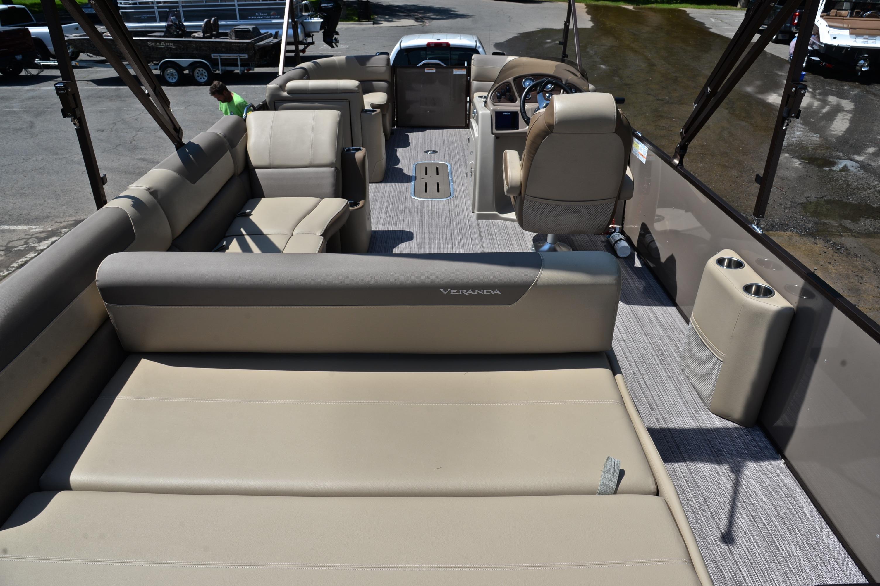 2020 Veranda VR22 pontoon boat interior with beige seating and modern helm.