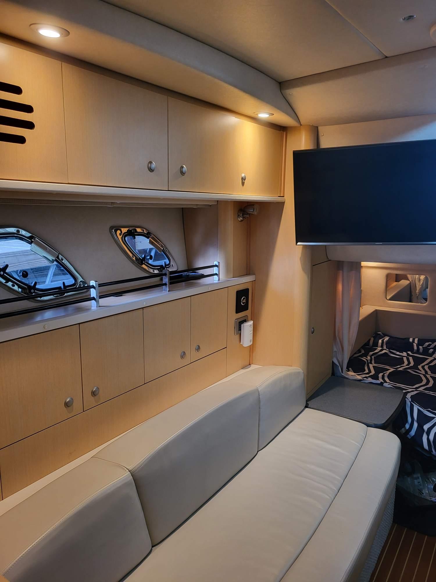 Luxurious interior of 2009 Sea Ray 310 Sundancer yacht with modern amenities.