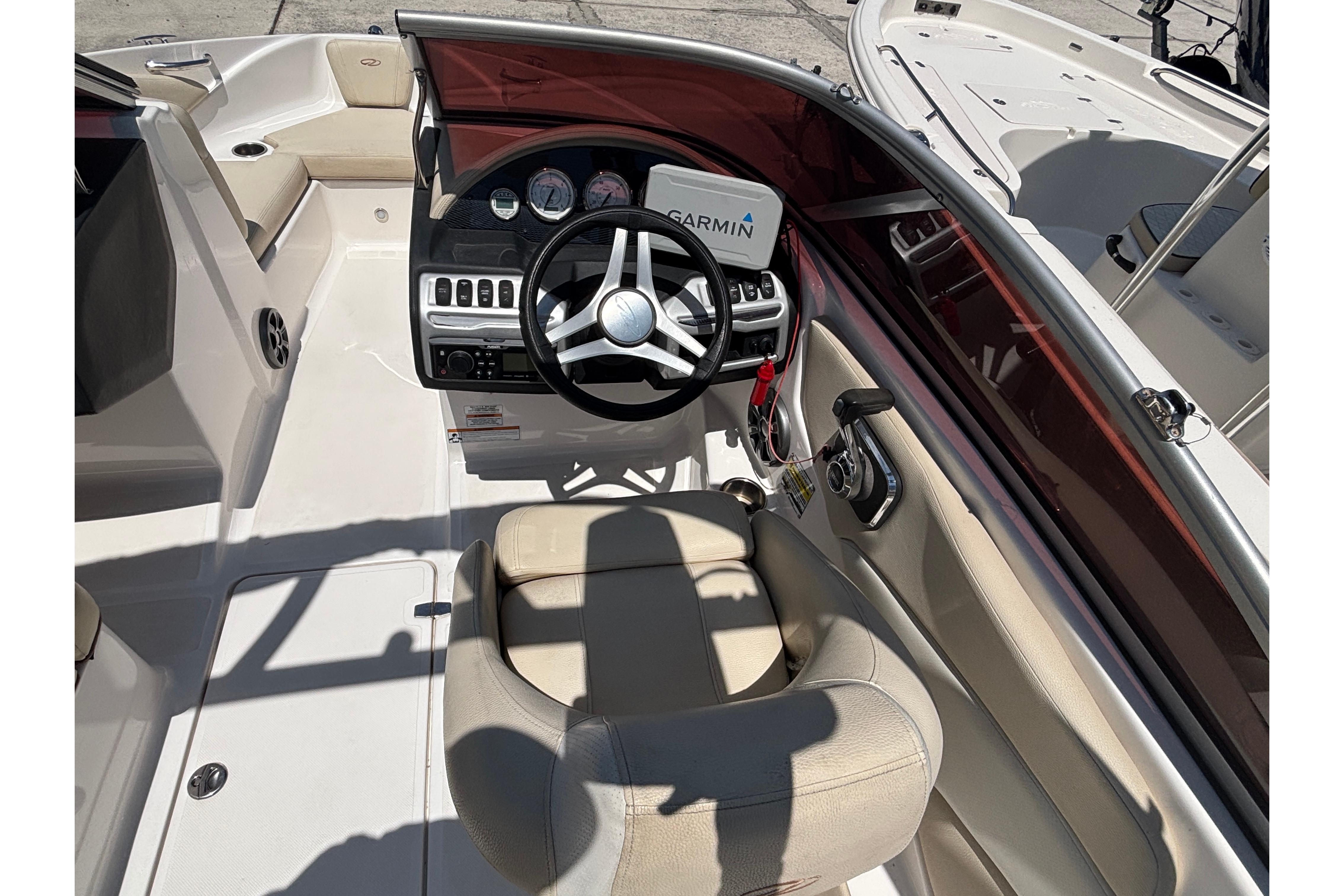 2018 Regal 1900 ES Bowrider interior with steering wheel and Garmin navigation system.