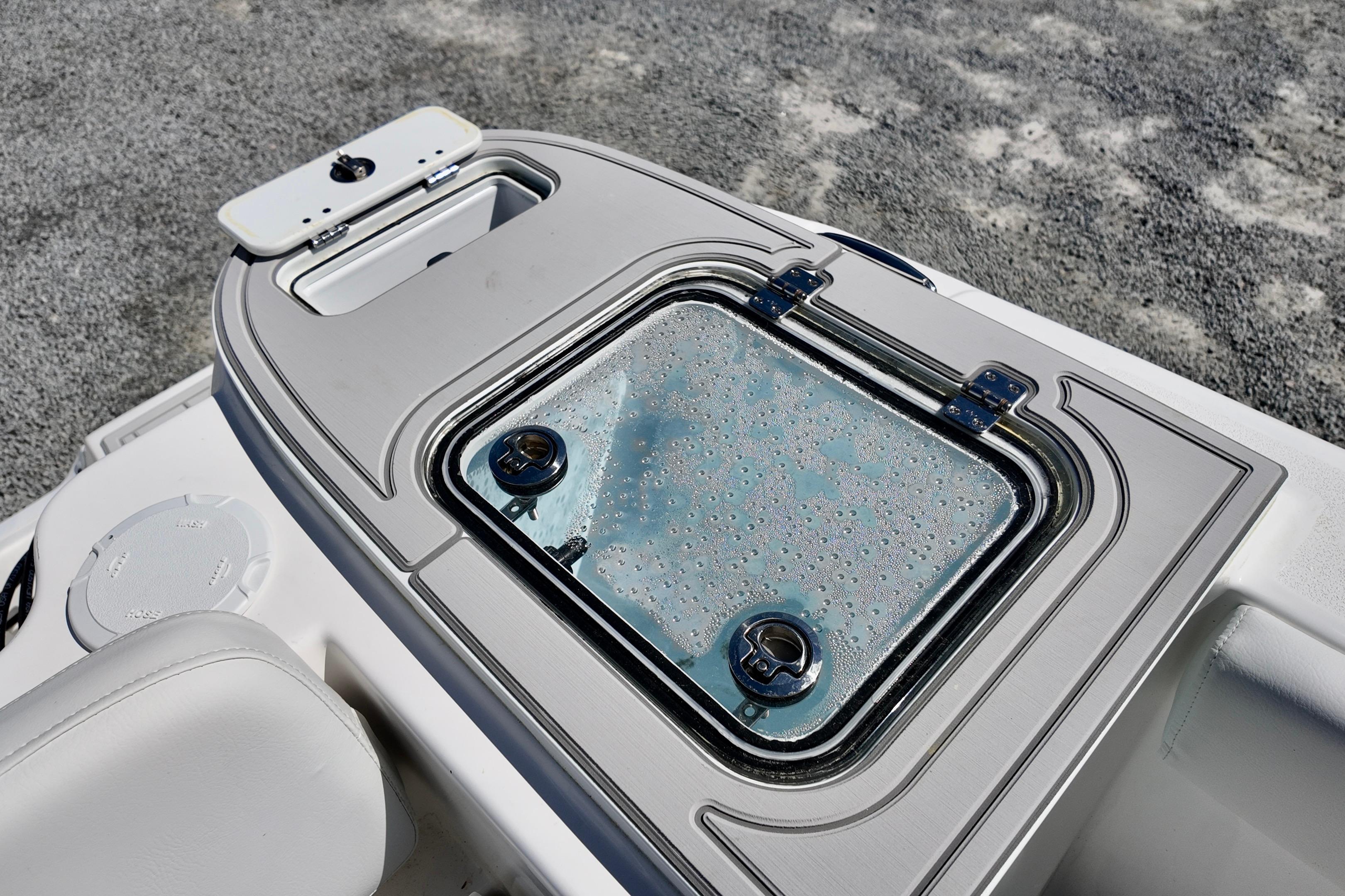 2026 Sea Fox 248 Commander boat detail, featuring a sleek, modern livewell with a transparent lid.