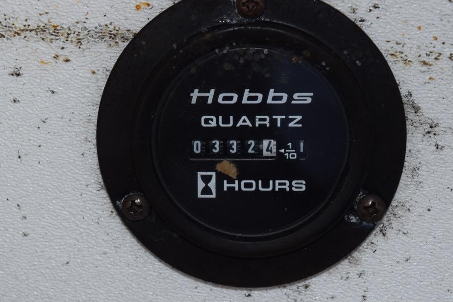 Hobbs quartz hour meter showing 3324.1 hours on a 2006 Cobalt 240.