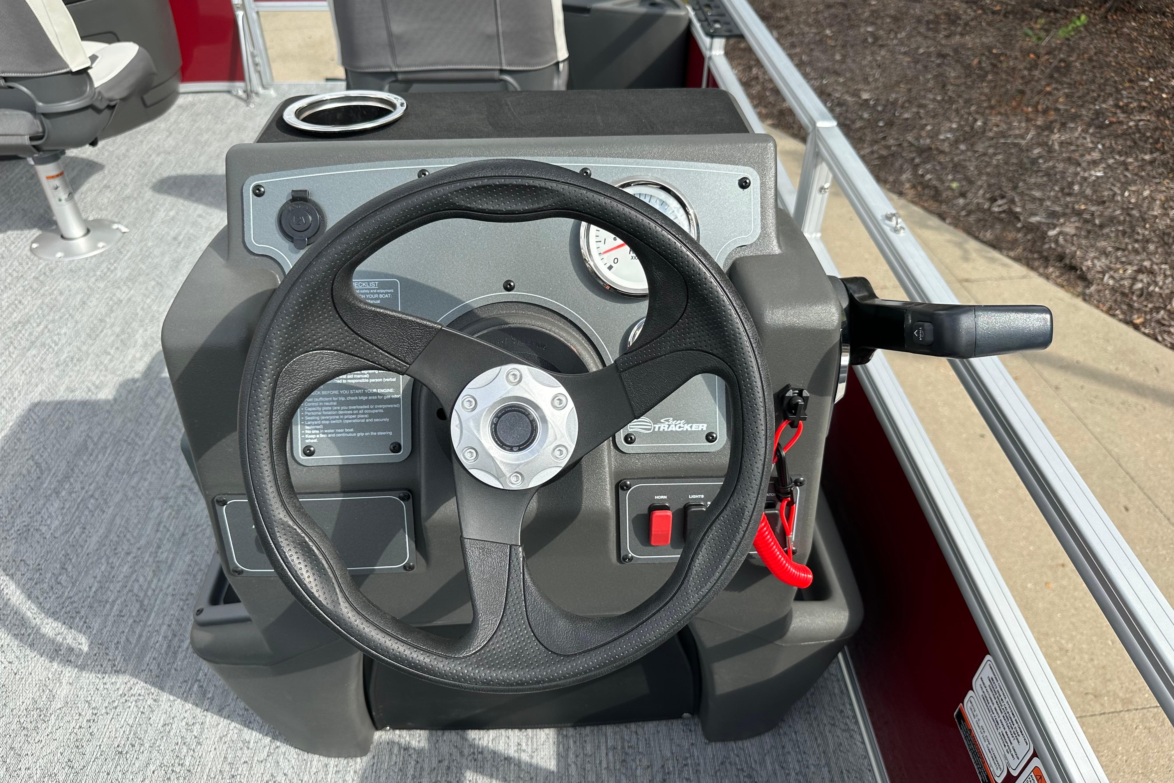 Steering console of 2026 Sun Tracker Bass Buggy 18 DLX pontoon boat.