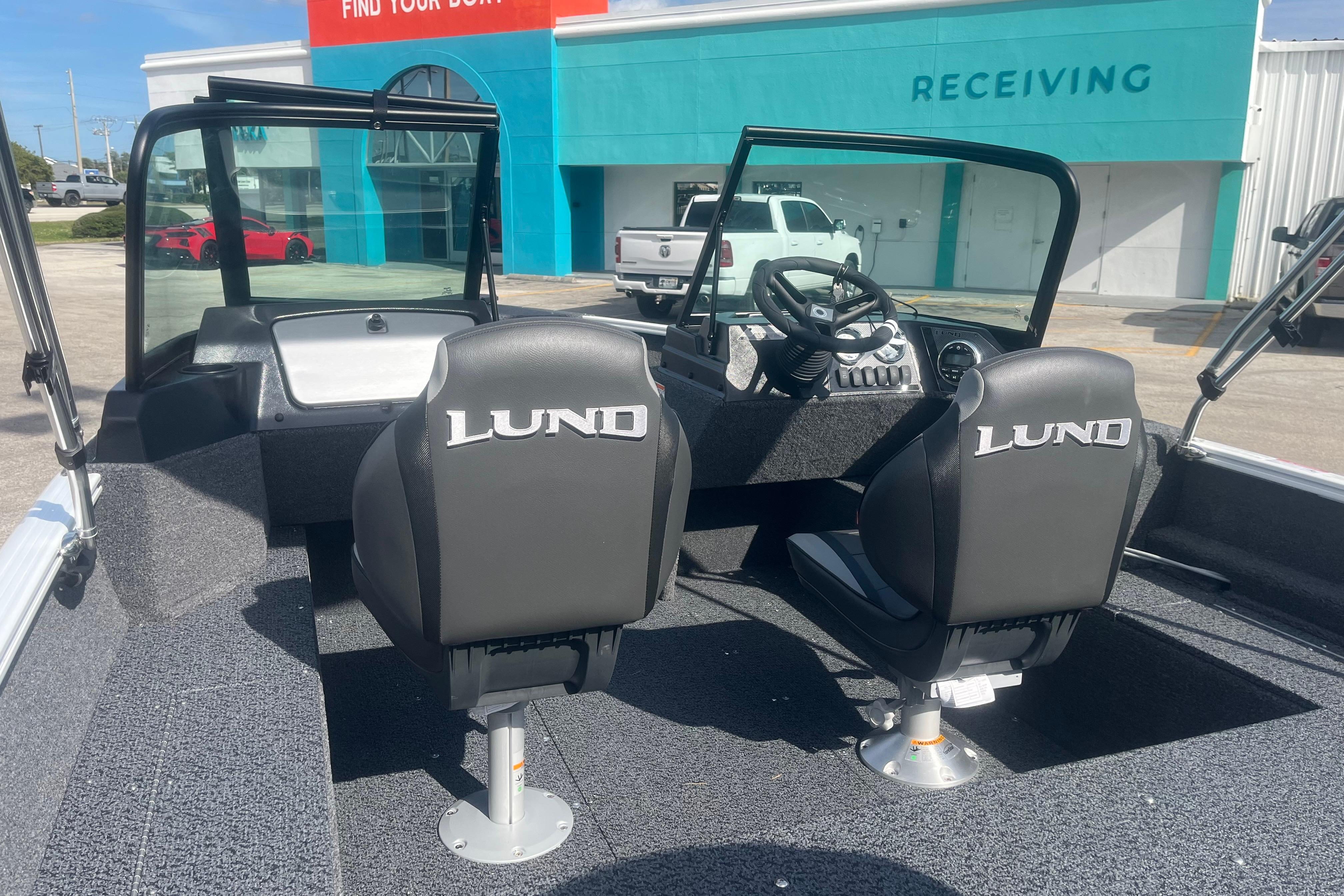 2026 Lund 1650 Rebel XL Sport boat interior with two seats and steering console.