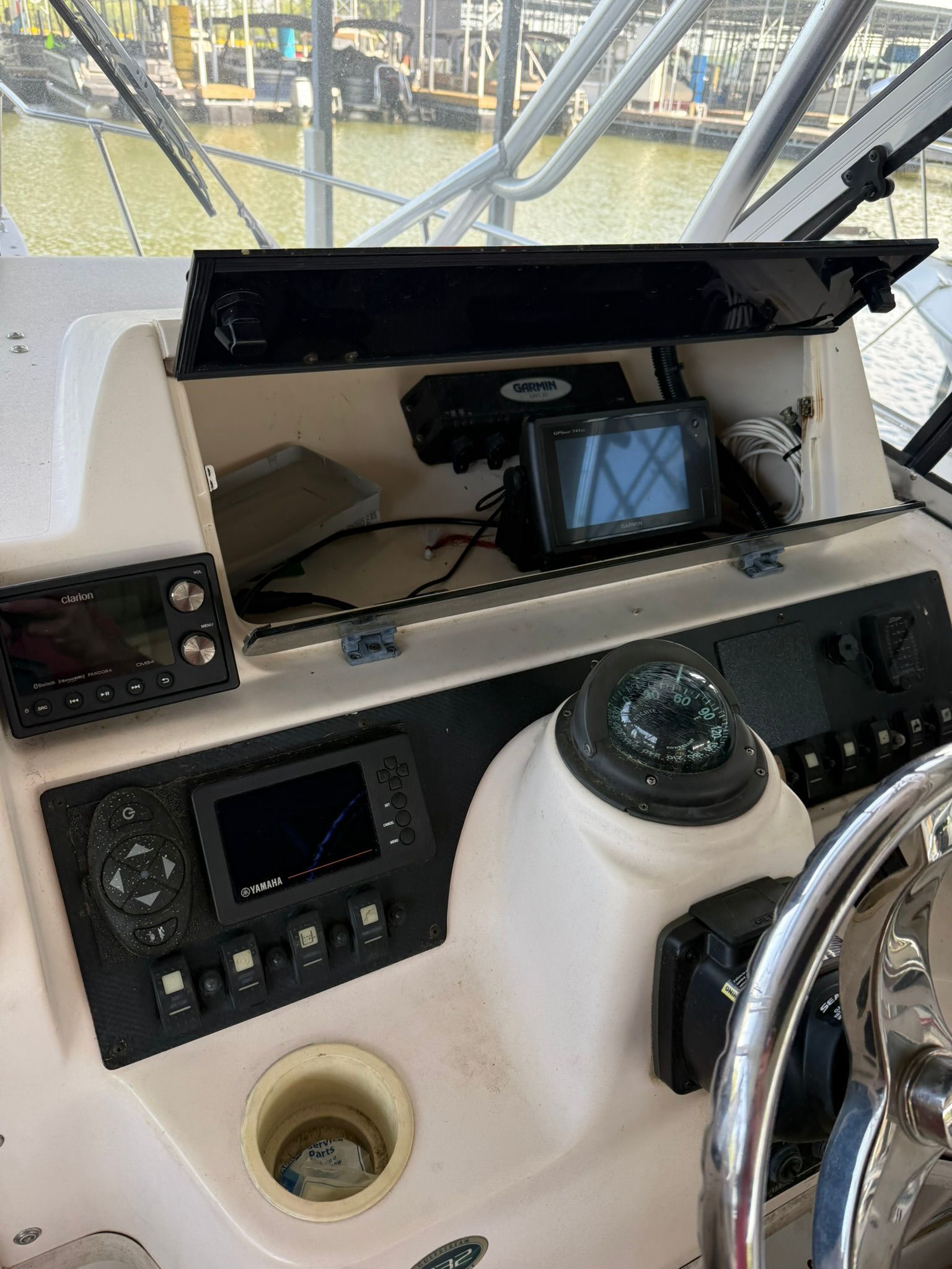 The image shows the cockpit of a Grady-White Gulfstream 232 boat with various instruments.
