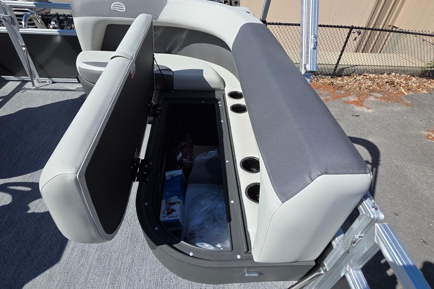 2026 Sun Tracker BB 16 XLS boat seat with open storage compartment and cup holders.