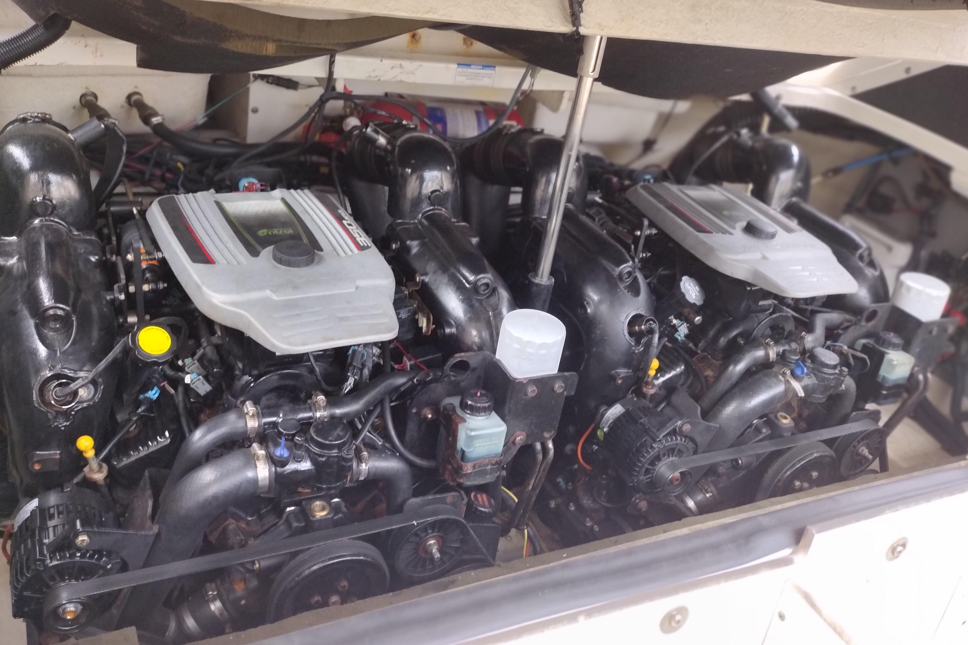 Engine compartment of a 2013 Sea Ray 300 SLX boat, showcasing dual engines.