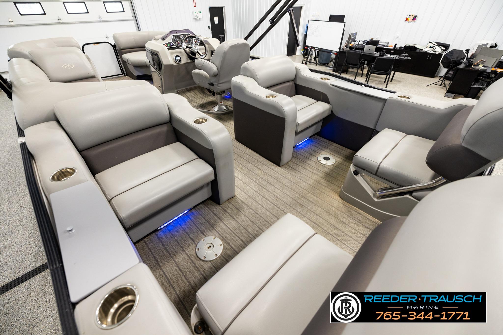 2019 Manitou Oasis SR VP pontoon boat interior with plush seating and modern dashboard.