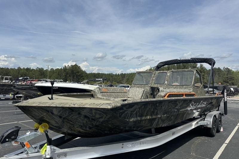 2026 SeaArk EasyCat boat on trailer, parked outdoors under a clear sky.