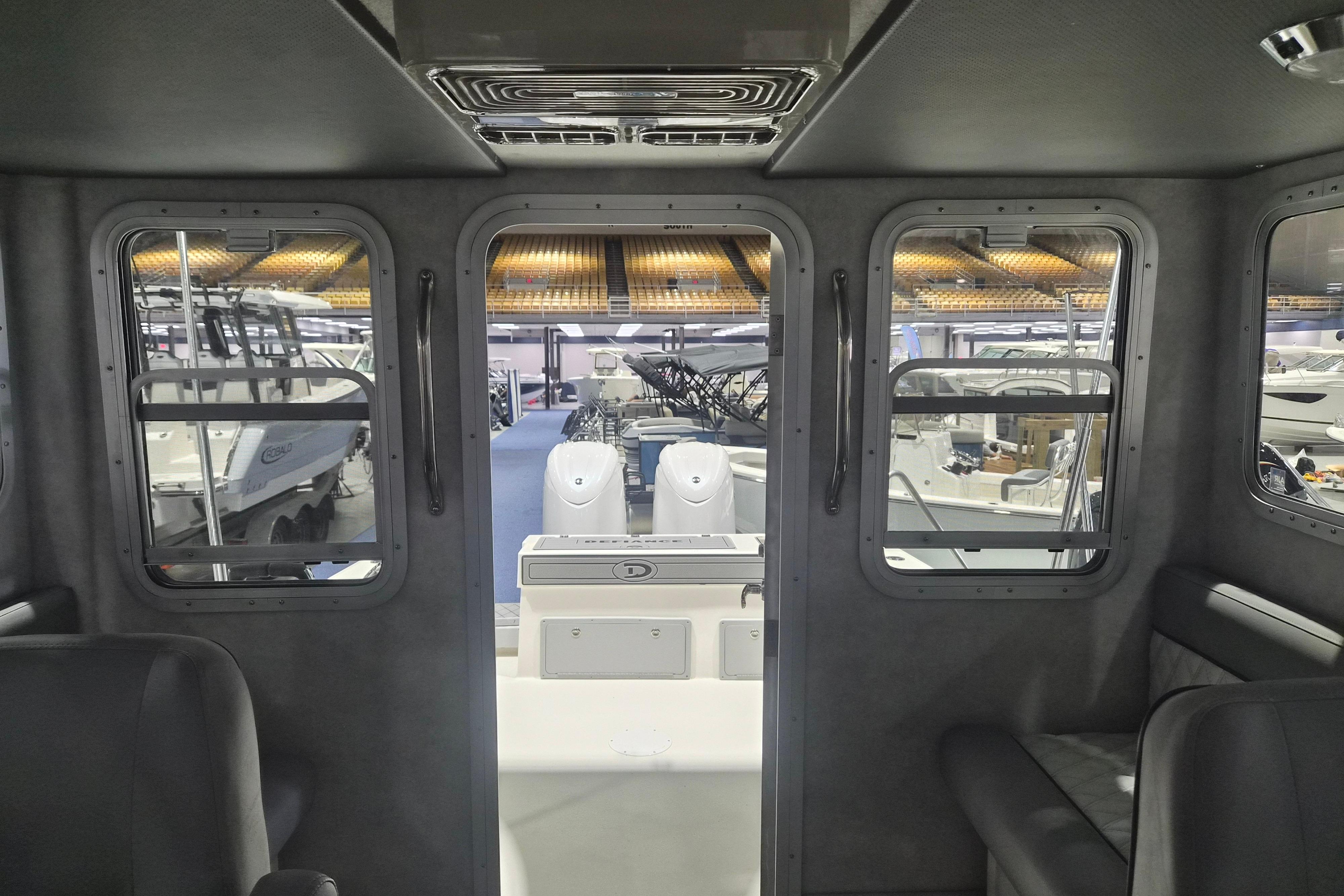 Interior view of 2026 Defiance Admiral 260 EX boat at a showroom display.