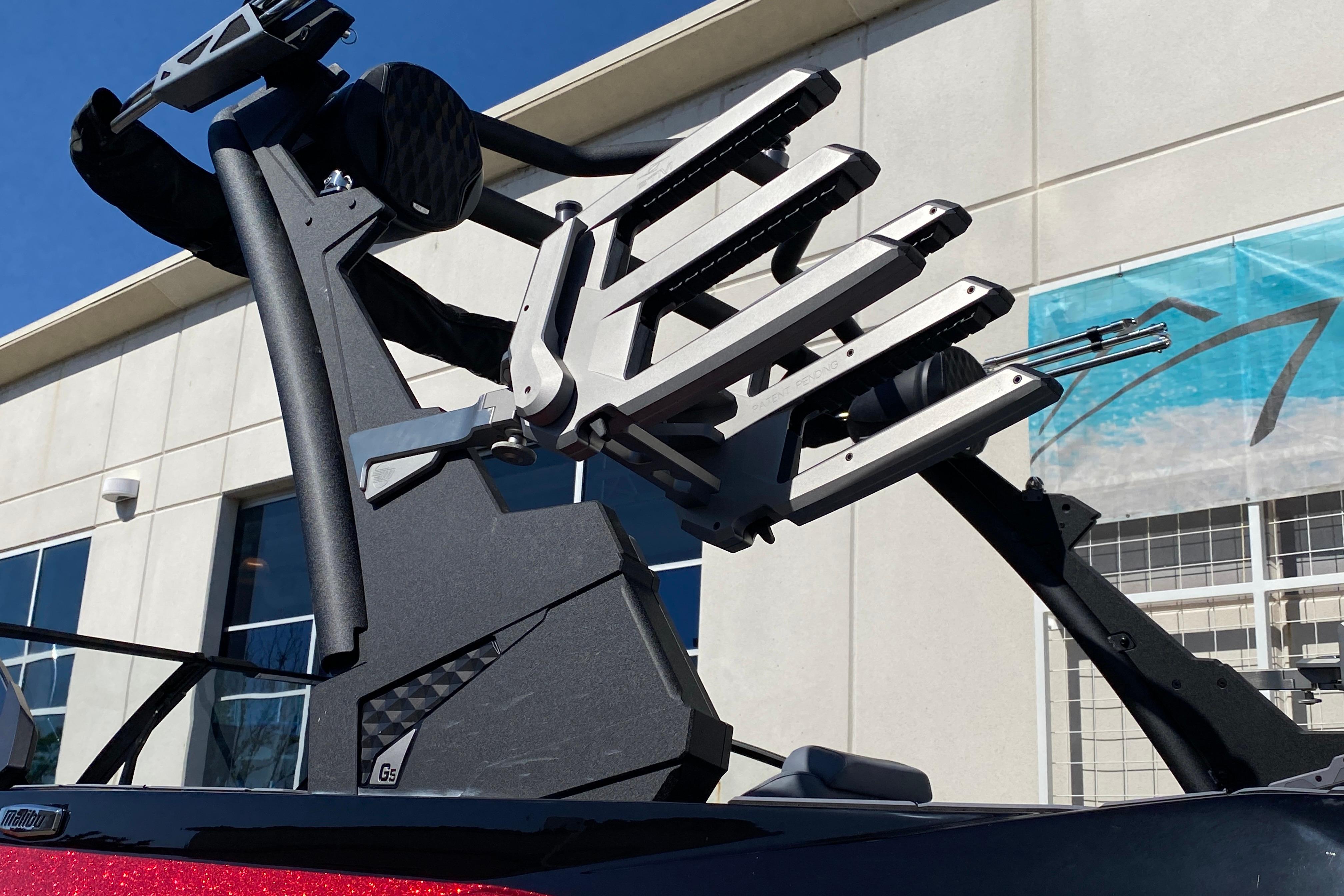 2025 Malibu Wakesetter 23 LSV boat tower with wakeboard racks, exterior view.
