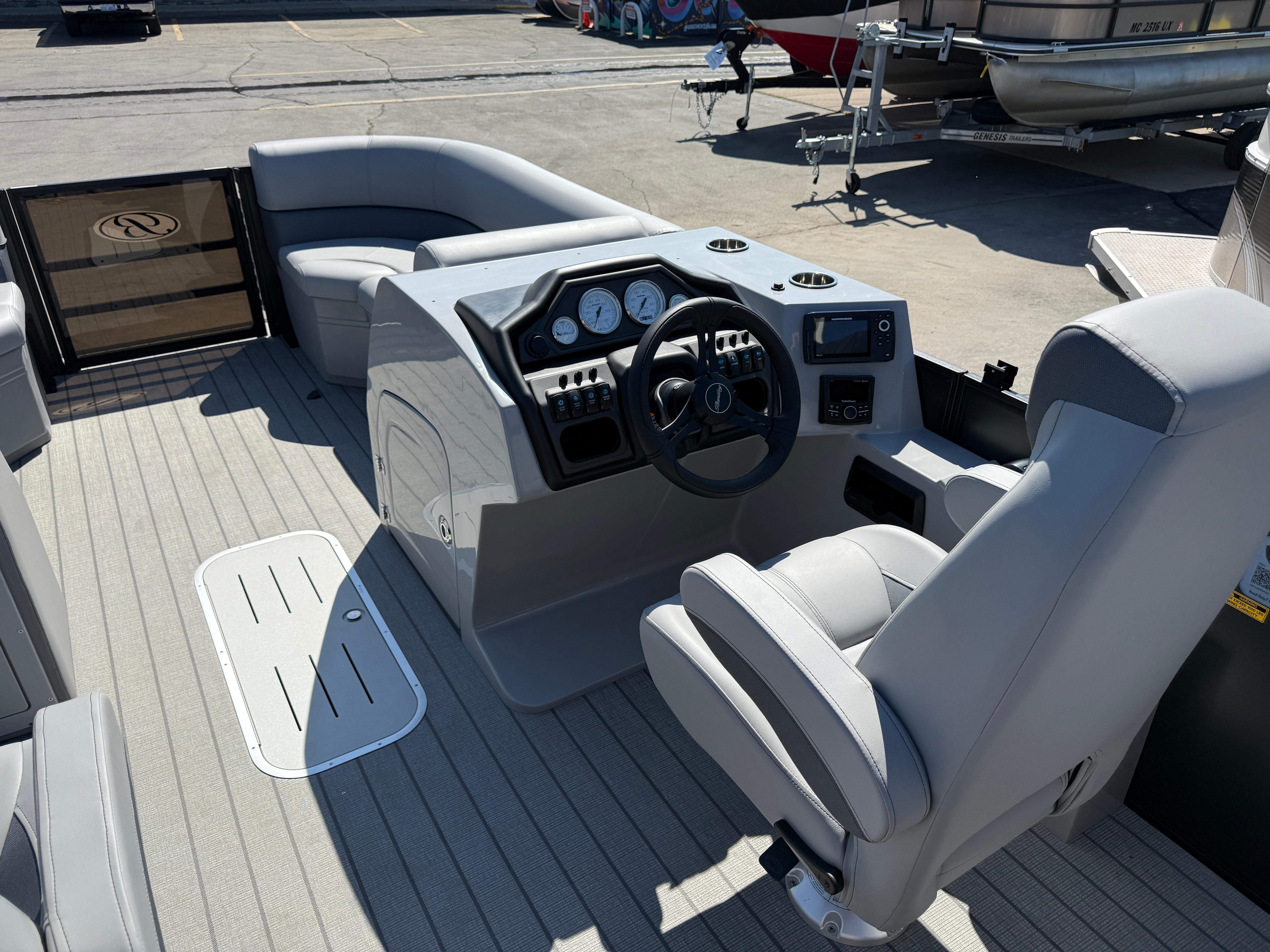 2026 Bentley Pontoons Legacy 223 Navigator interior with steering console and seating.