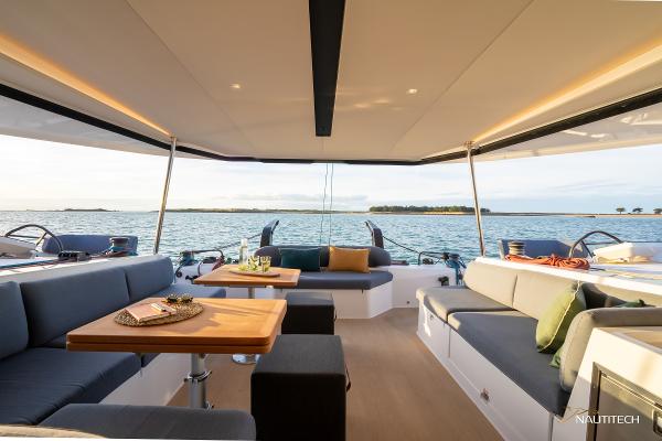 Luxurious interior of 2025 Nautitech 48 Open catamaran with ocean view.