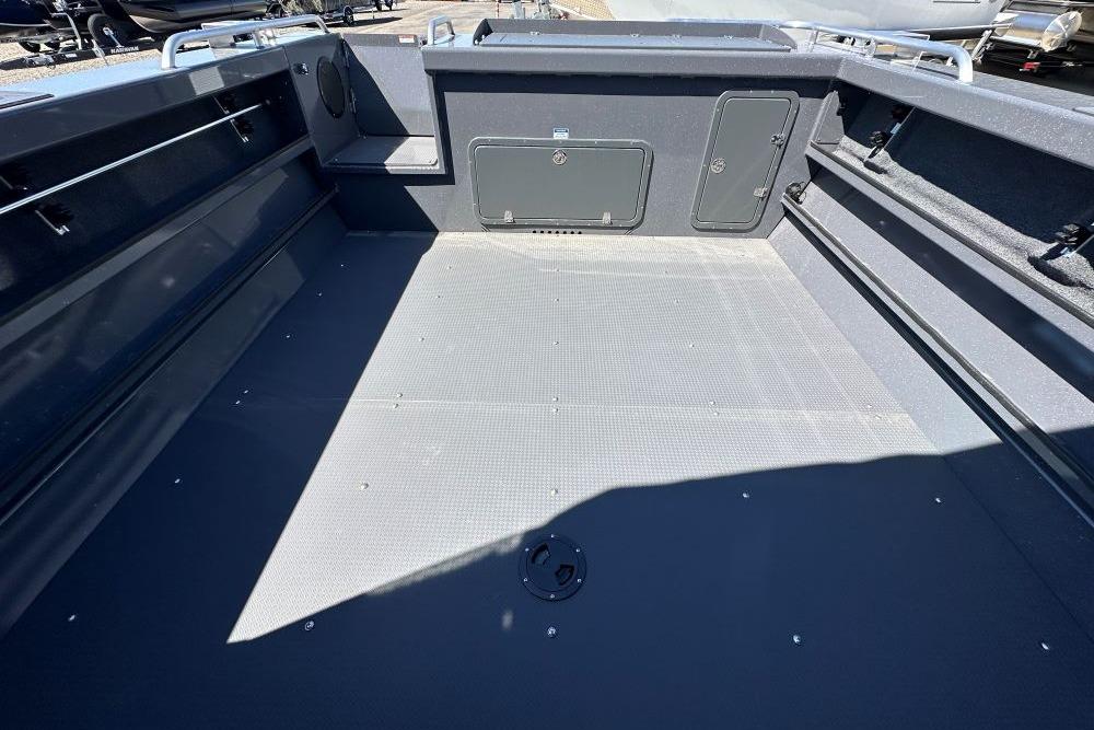 2026 Weldcraft 240 Maverick DV boat interior with spacious deck and storage compartments.