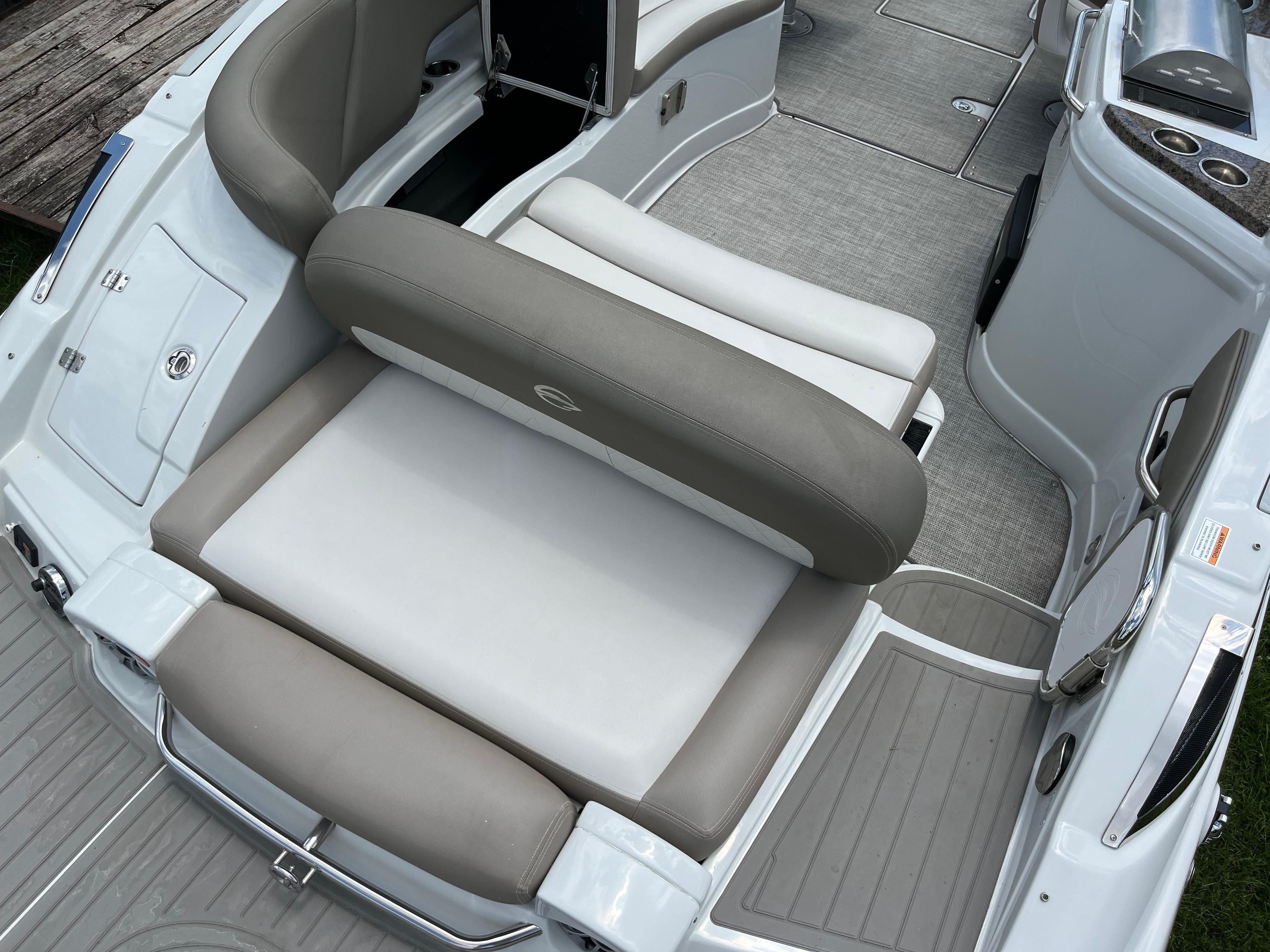 Interior of a 2019 Crownline E 285 boat with gray and white seating.