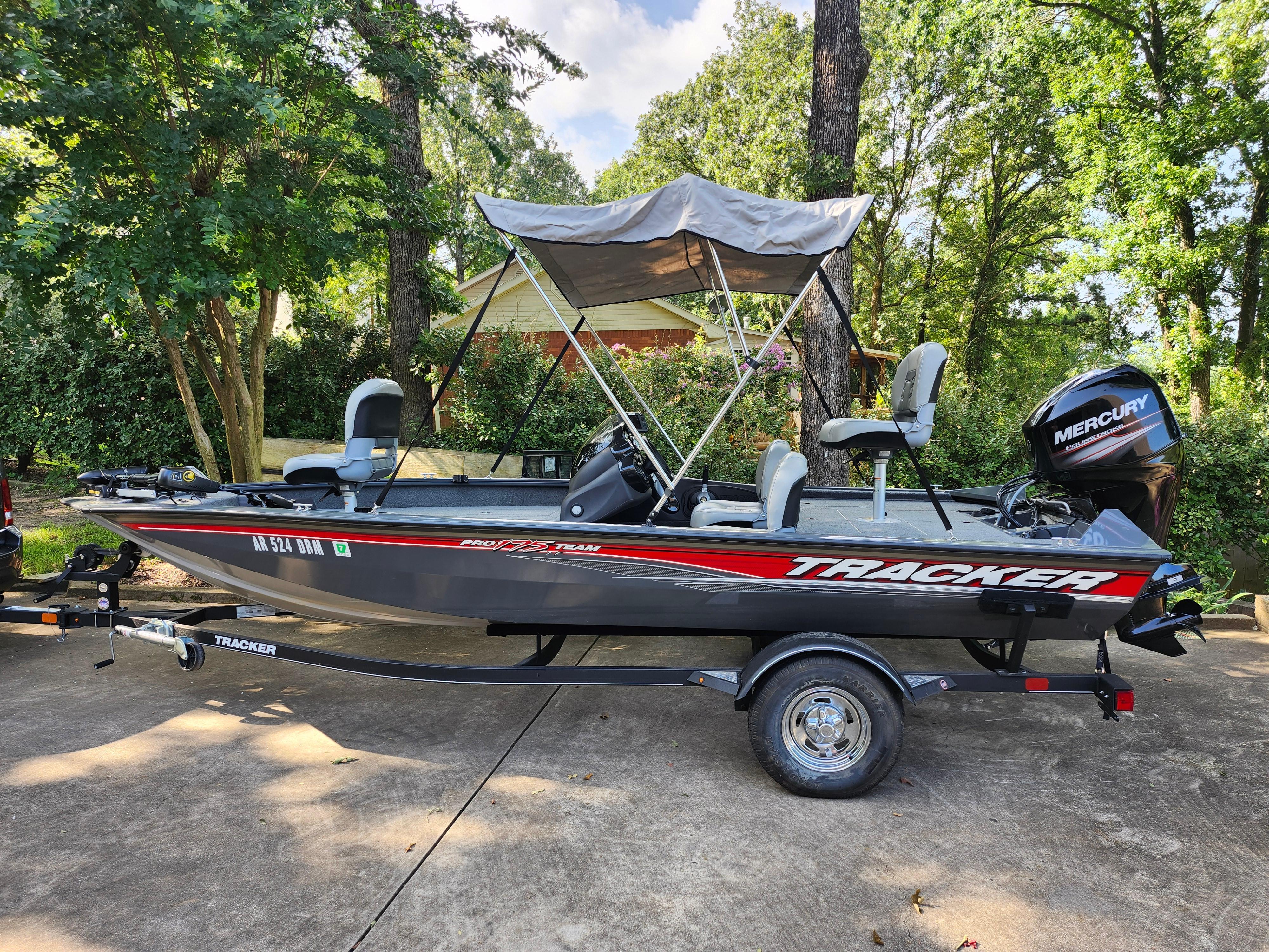 2018 Tracker Pro 175 TF fishing boat with canopy and Mercury outboard motor on trailer.