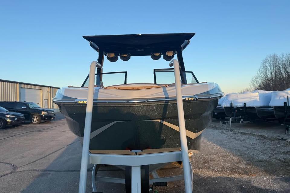 2026 Tigé Z3 boat on trailer, parked outdoors under clear blue sky.