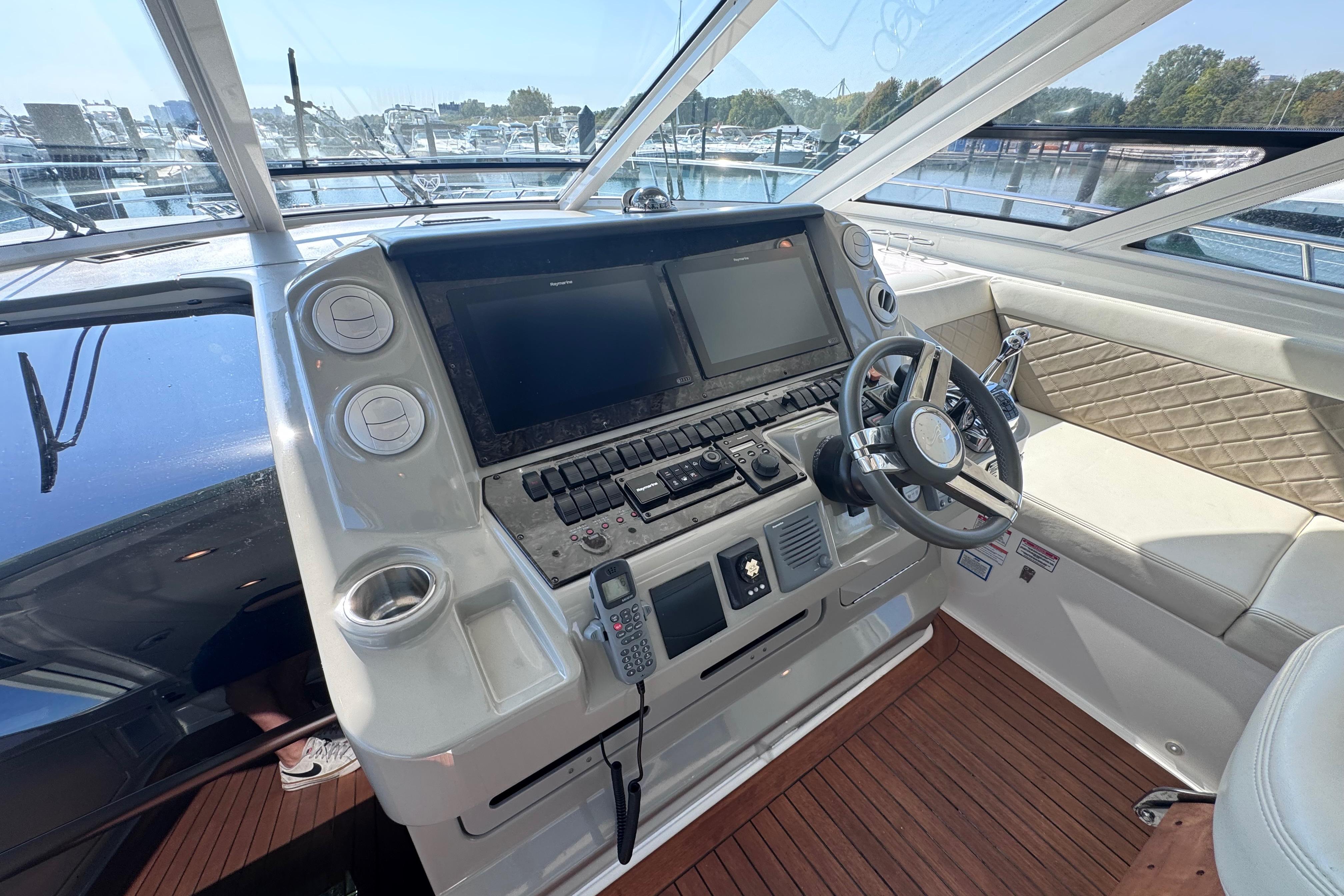 Helm of 2011 Sea Ray 540 Sundancer yacht with modern controls and navigation systems.