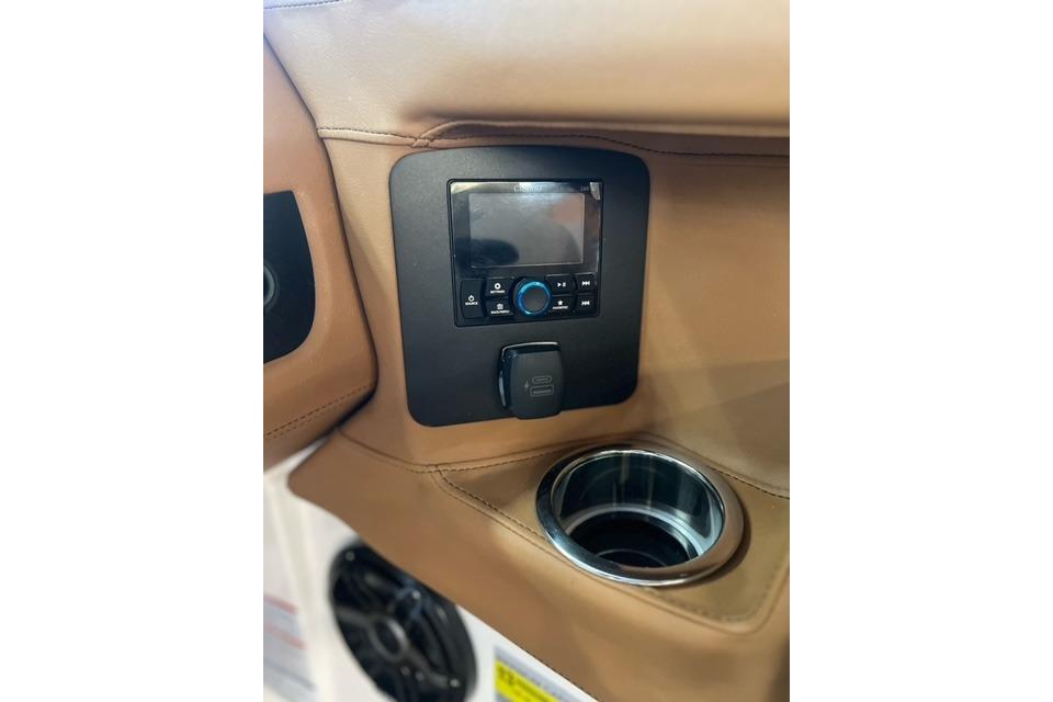 2025 Chaparral 247 SSX boat interior with control panel and cup holder.