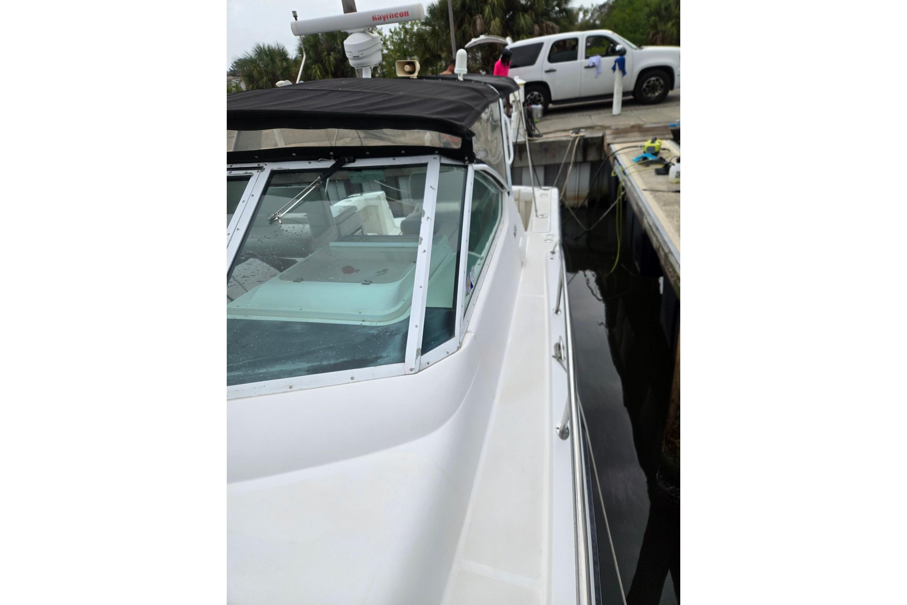 2002 Tiara Yachts 3500 Open docked, featuring sleek design and spacious deck.