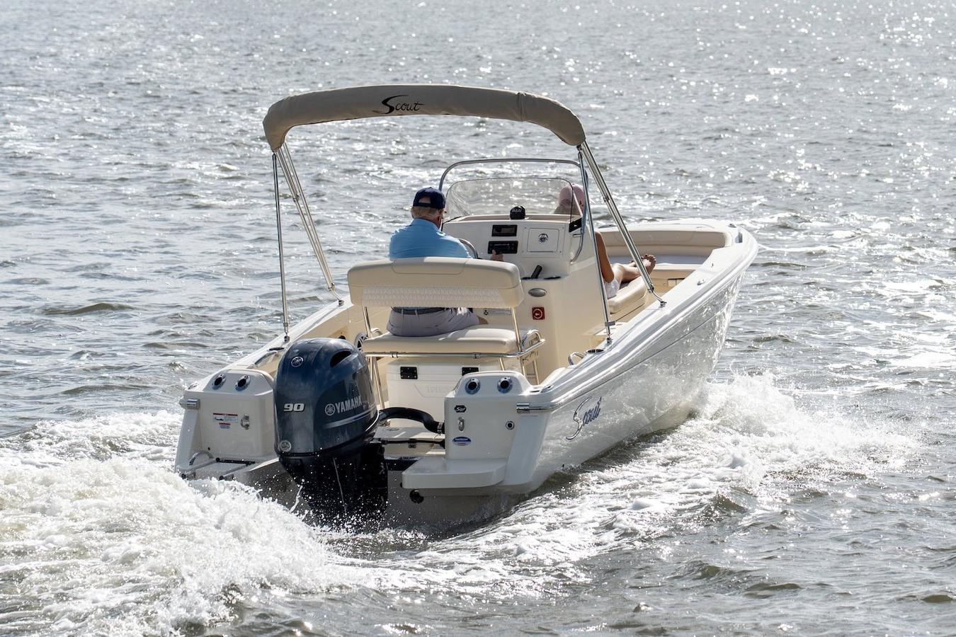 2026 Scout 188 Sportfish boat cruising on open water, featuring Yamaha outboard motor.