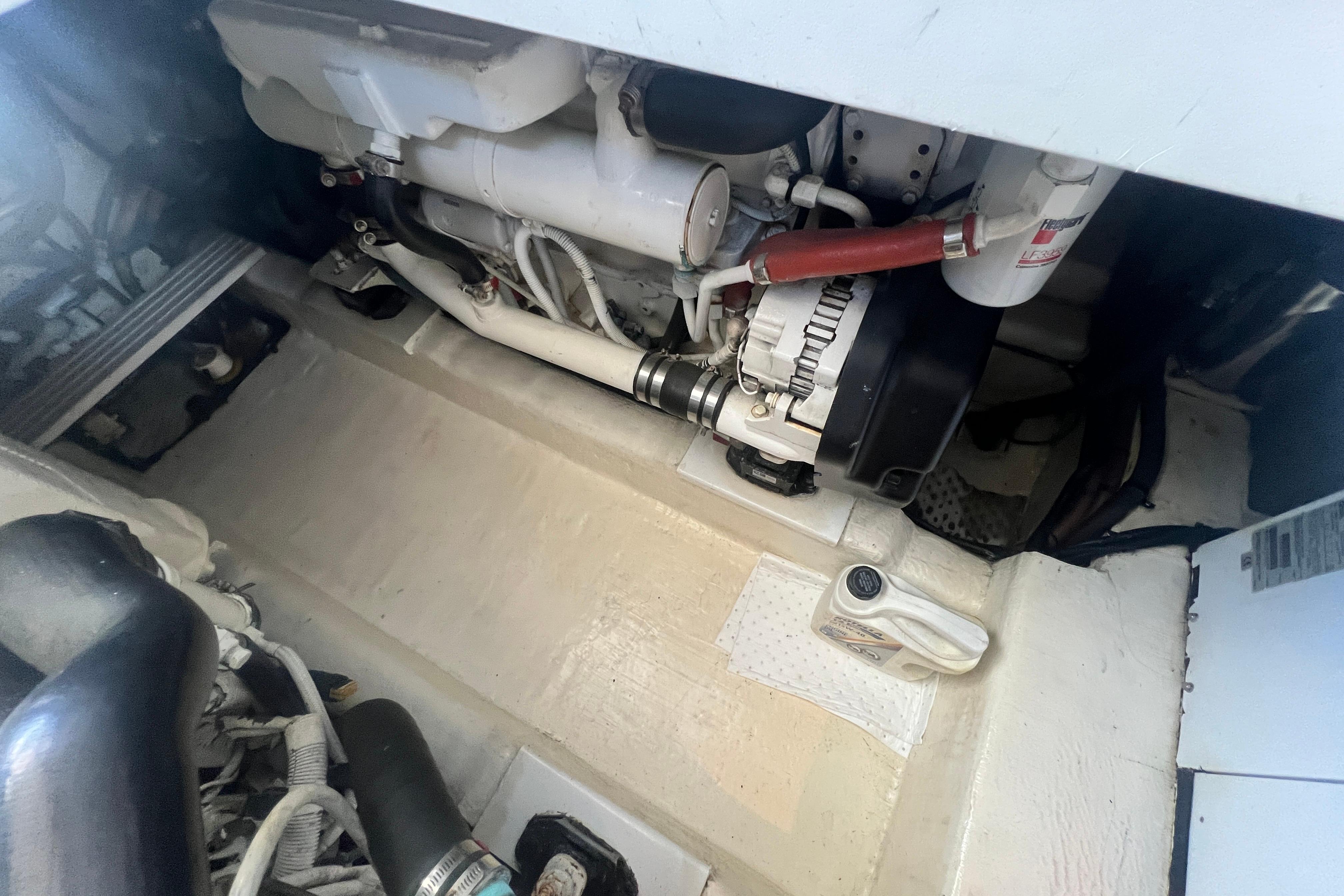 Engine compartment of a 2007 Riviera 33 Flybridge boat, showcasing mechanical components.