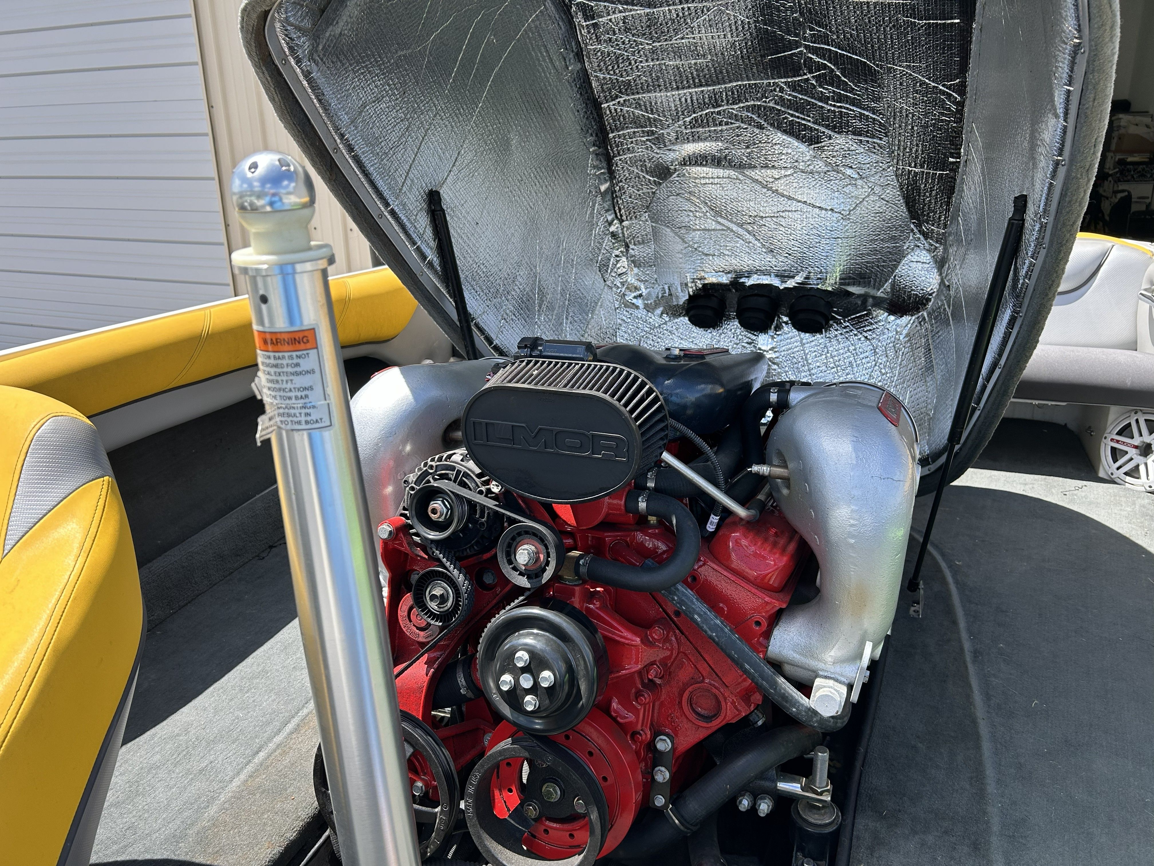 Engine of a 2011 MasterCraft PS197 boat with open cover.