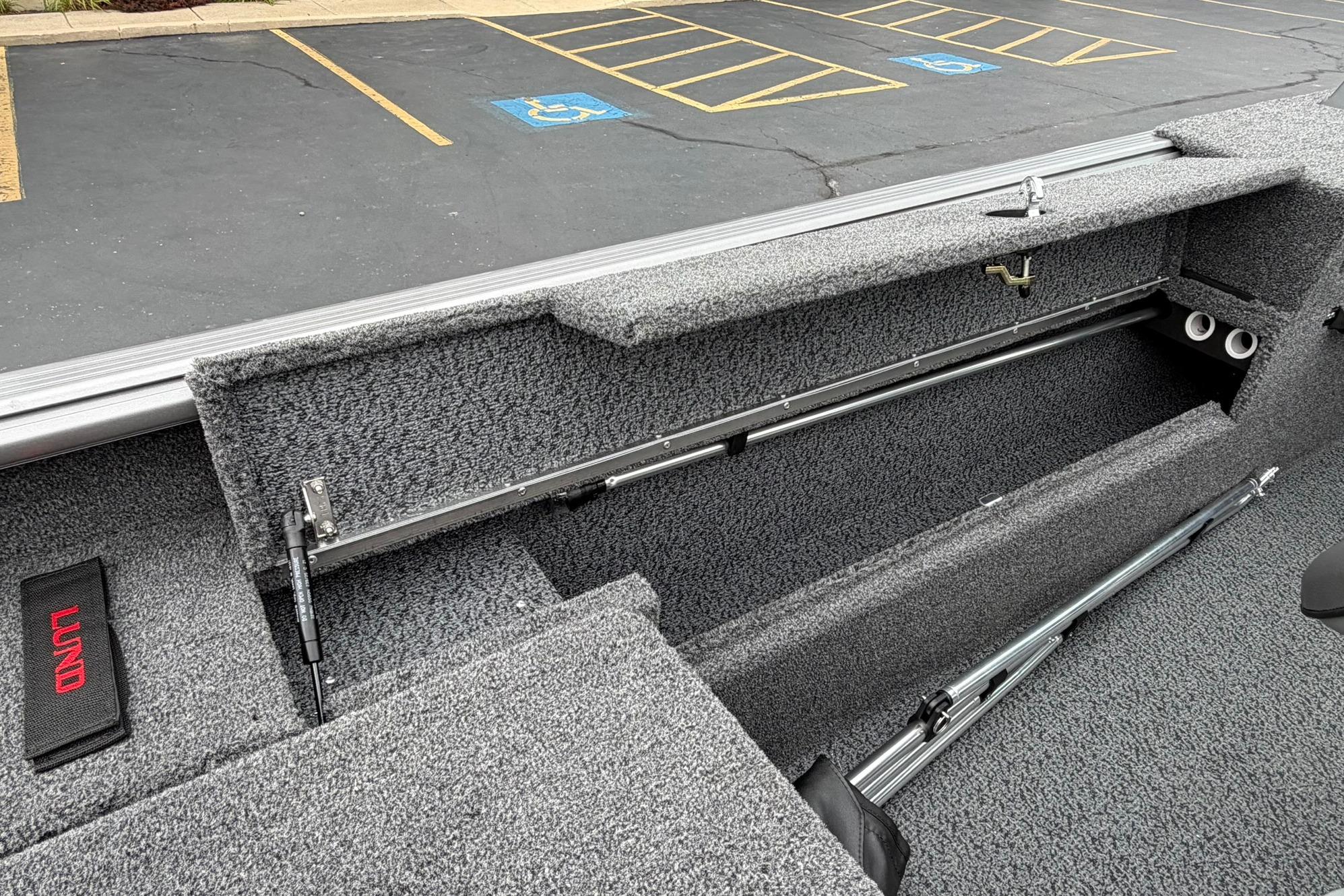 Interior view of 2027 Lund 1875 Impact XS Sport boat storage compartment.
