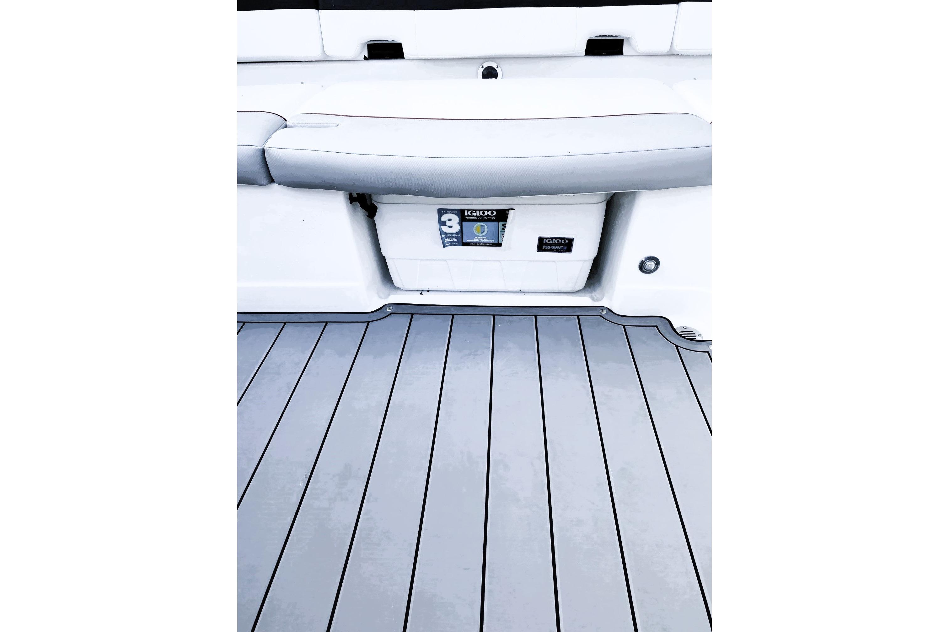 2023 Tahoe 210 Si Limited boat interior with cushioned seating and storage compartment.