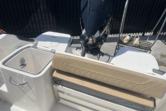 2023 Trophy T24 CC boat interior with seating and motor.