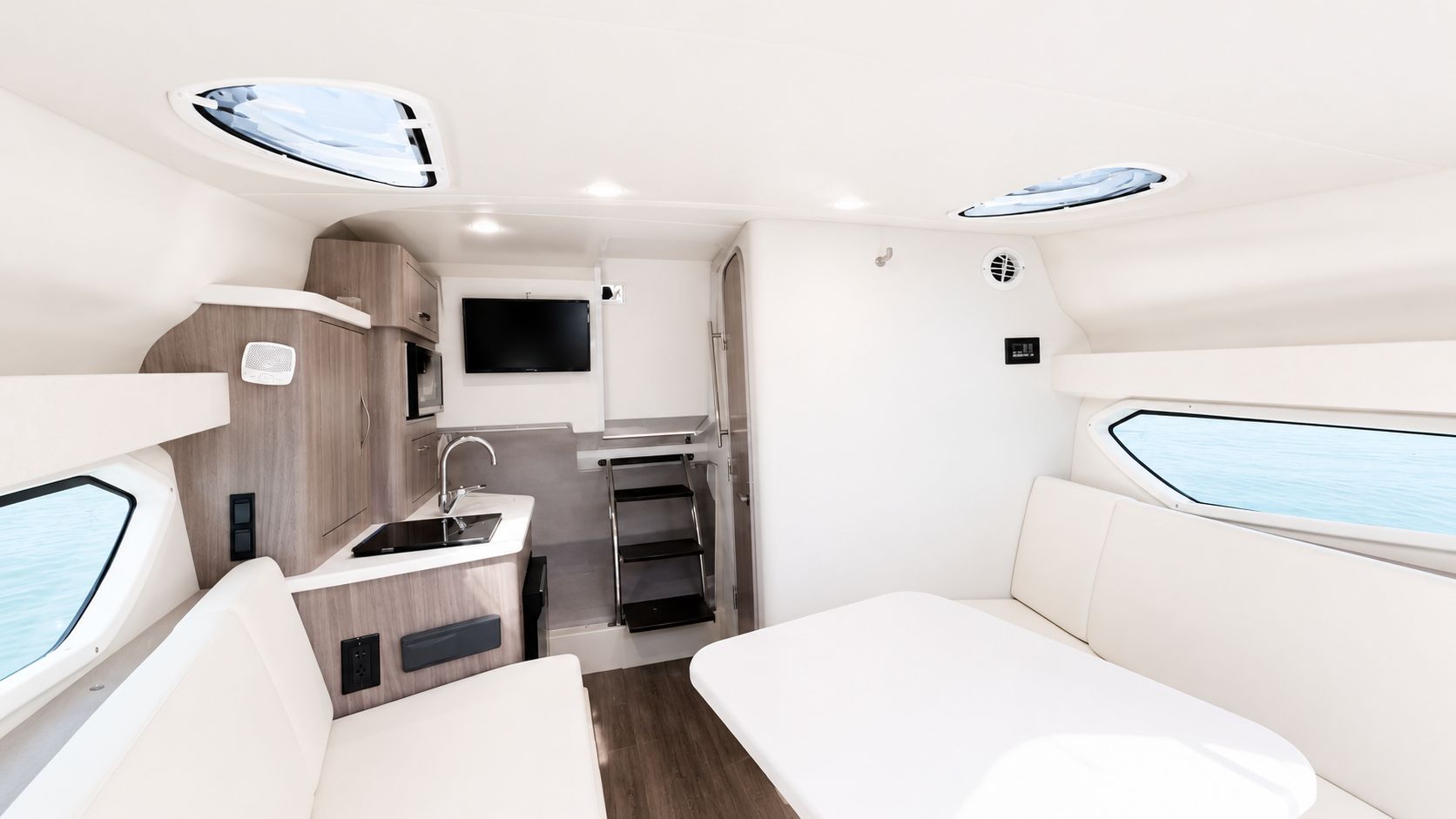 Interior of the 2020 Regal 28 Express with modern kitchen and seating area.