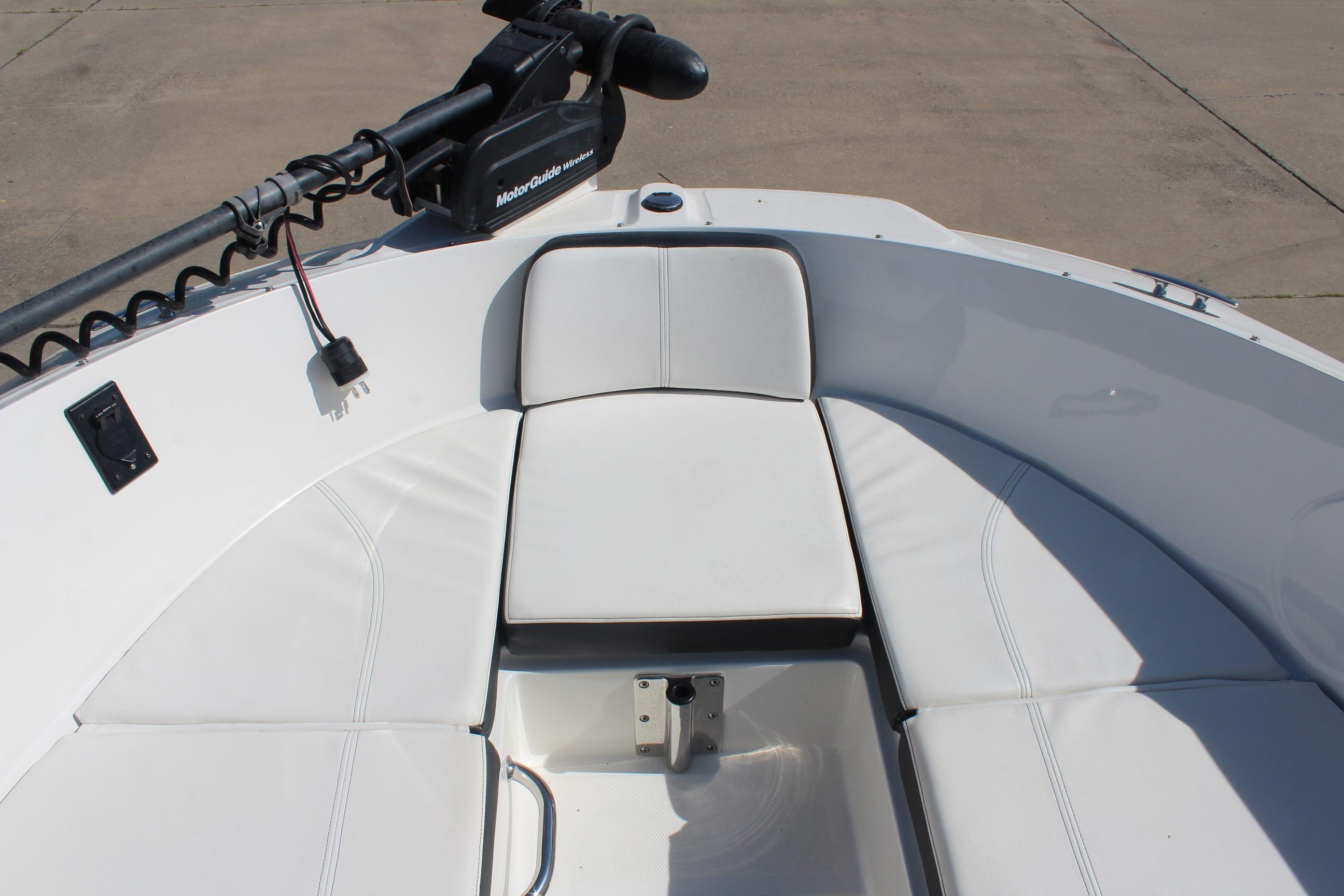 2015 Sea Ray 19 SPX OB boat interior with white cushioned seating and MotorGuide trolling motor.