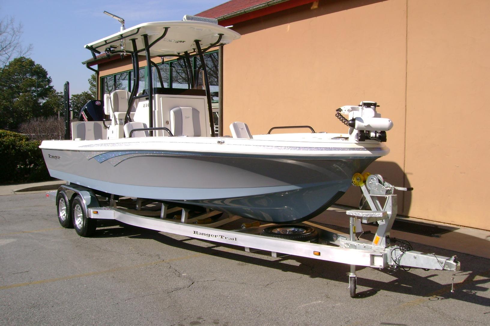 2026 Ranger 2360 Bay boat on trailer, parked outdoors.