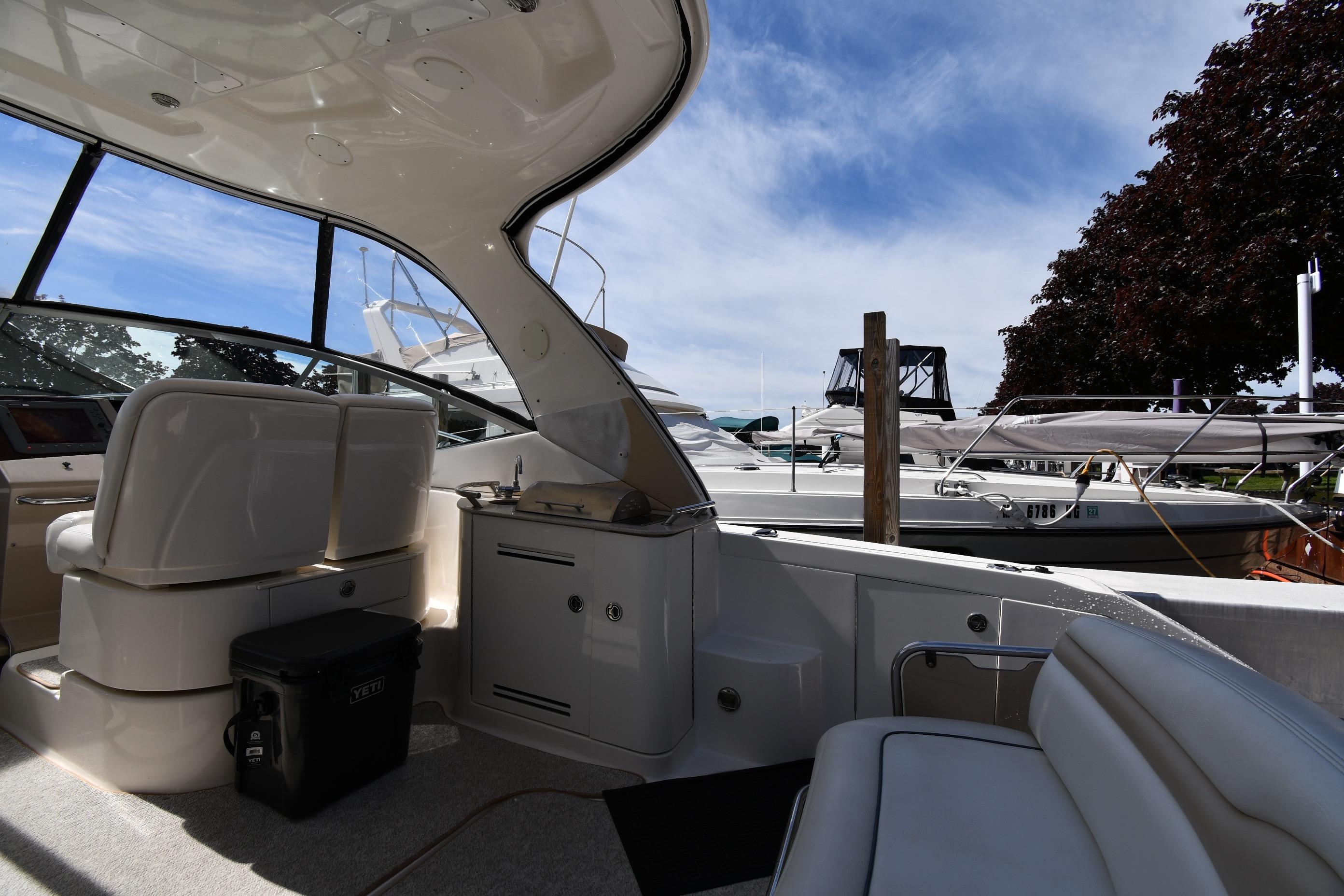 Interior view of a 2008 Sea Ray Sundancer 350 yacht docked at a marina.