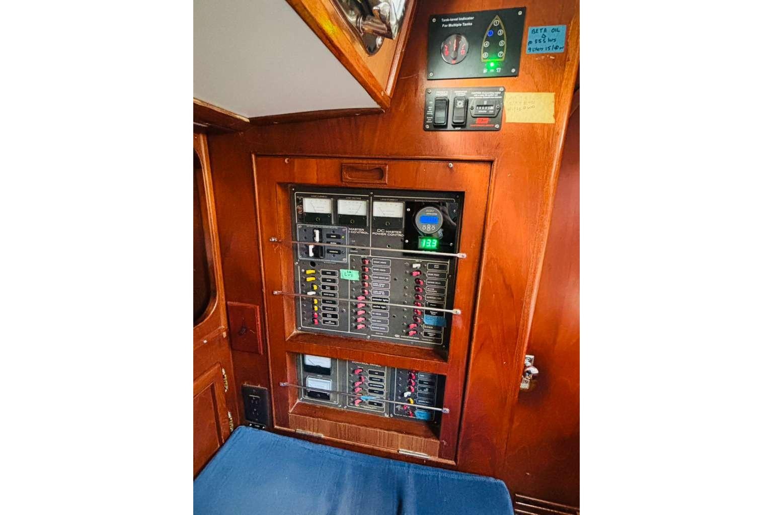 Electrical panel on 1982 Steven Custom Stevens 47 yacht, featuring gauges and switches.