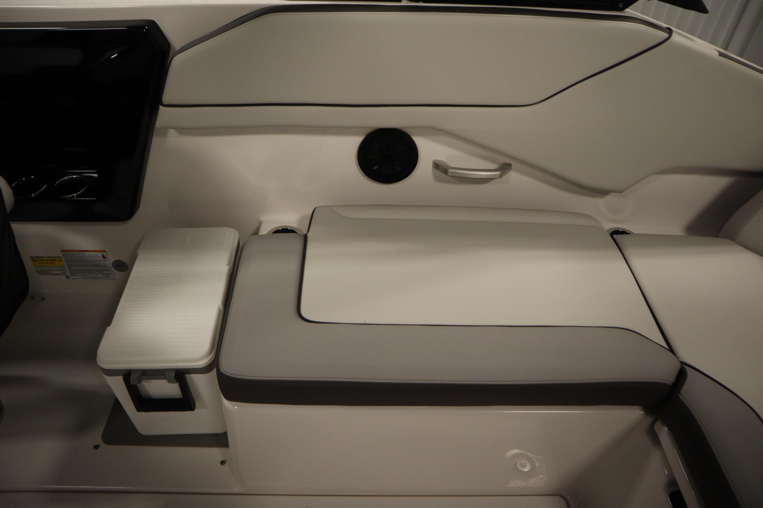 2026 Yamaha Boats AR250 interior seating with storage compartment and sleek design.